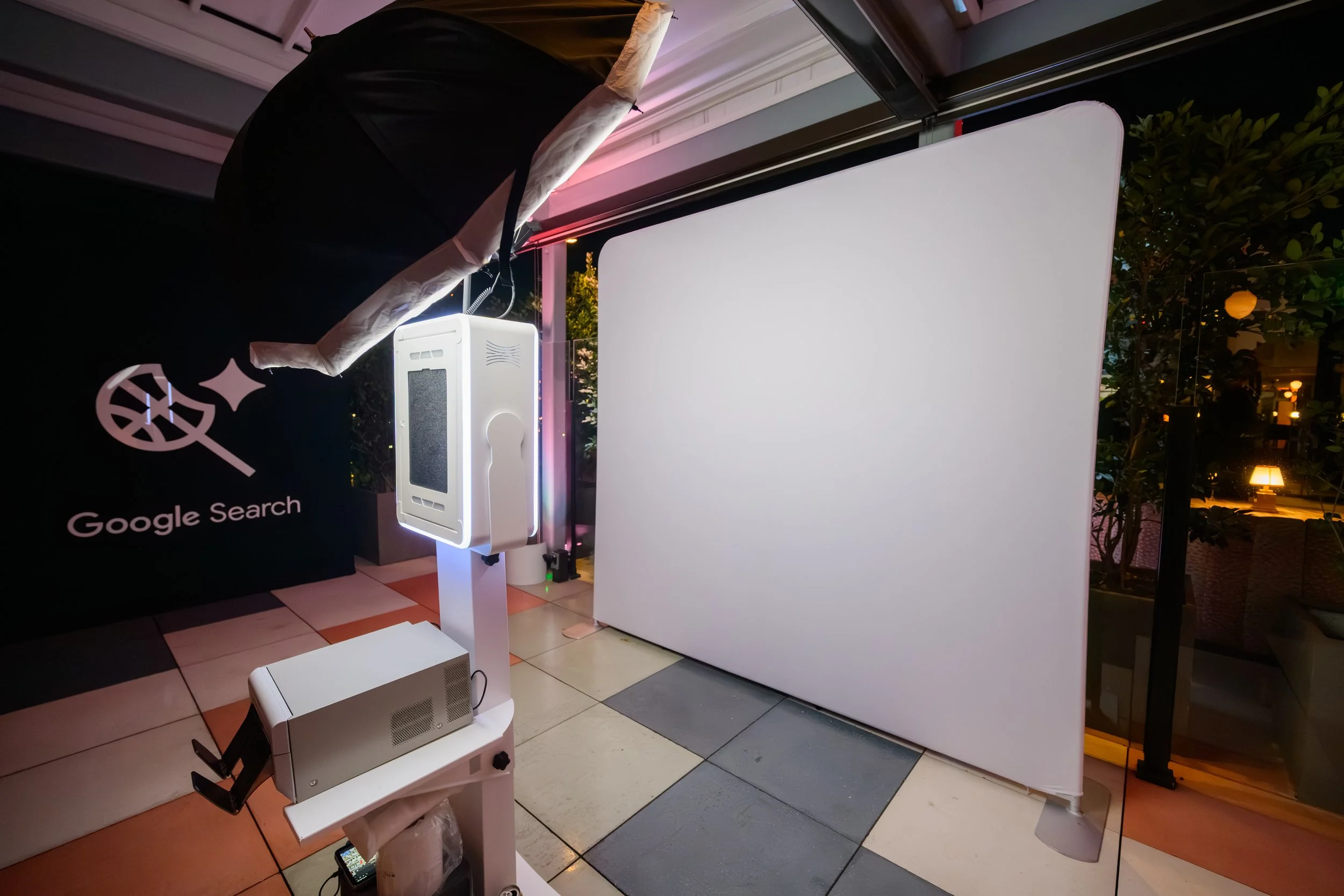 Custom branded photo booth experience created for the Google Search x Unanimous NBA All-Star Weekend rooftop event, featuring sleek modern styling and immersive guest activations produced by Loriann Serna and The Wife of the Party.