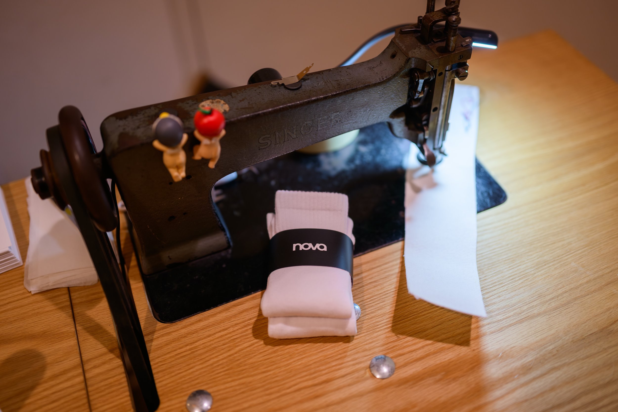 Vintage sewing machine display highlighting fashion design craftsmanship at Fashion Nova Nova Fitness launch experience produced by Wife of the Party