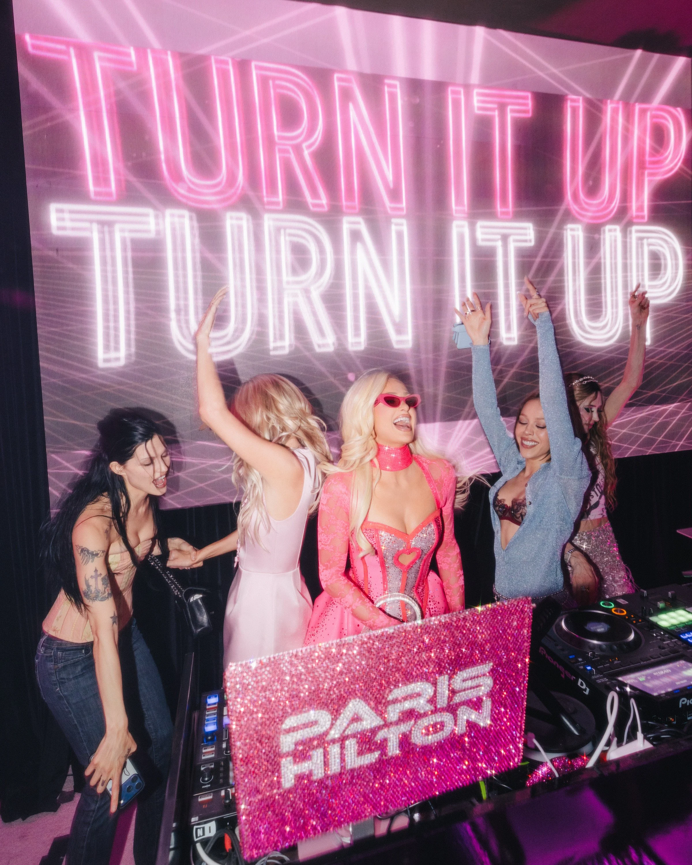 Paris Hilton DJs a set with an oversized LED visuals and a glowing dance floor designed by Loriann Serna of The Wife of the Party.