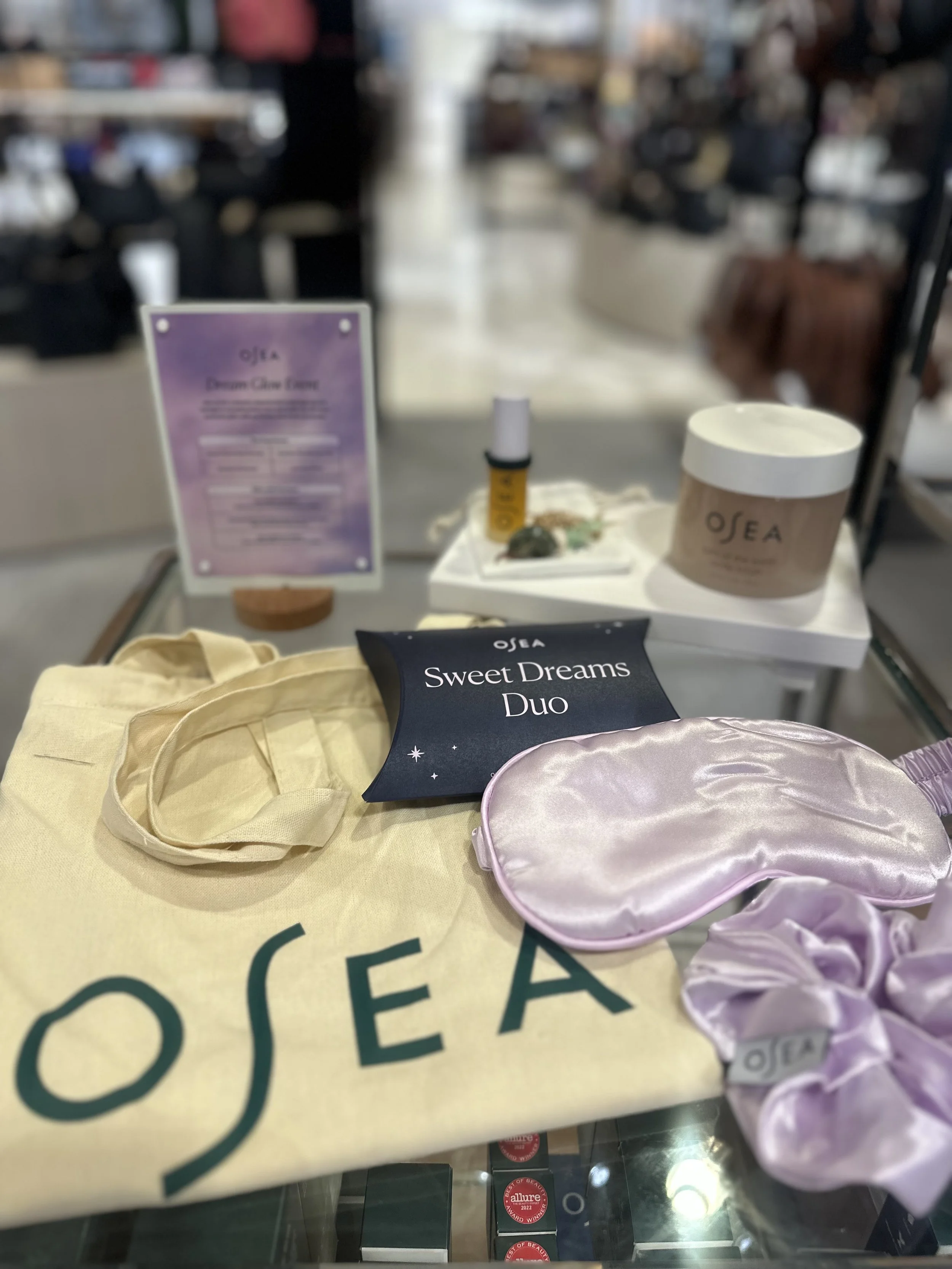 OSEA Dream Glow event gifting featuring silk sleep masks, skincare products, and branded tote bags styled by Loriann Serna of The Wife of the Party.