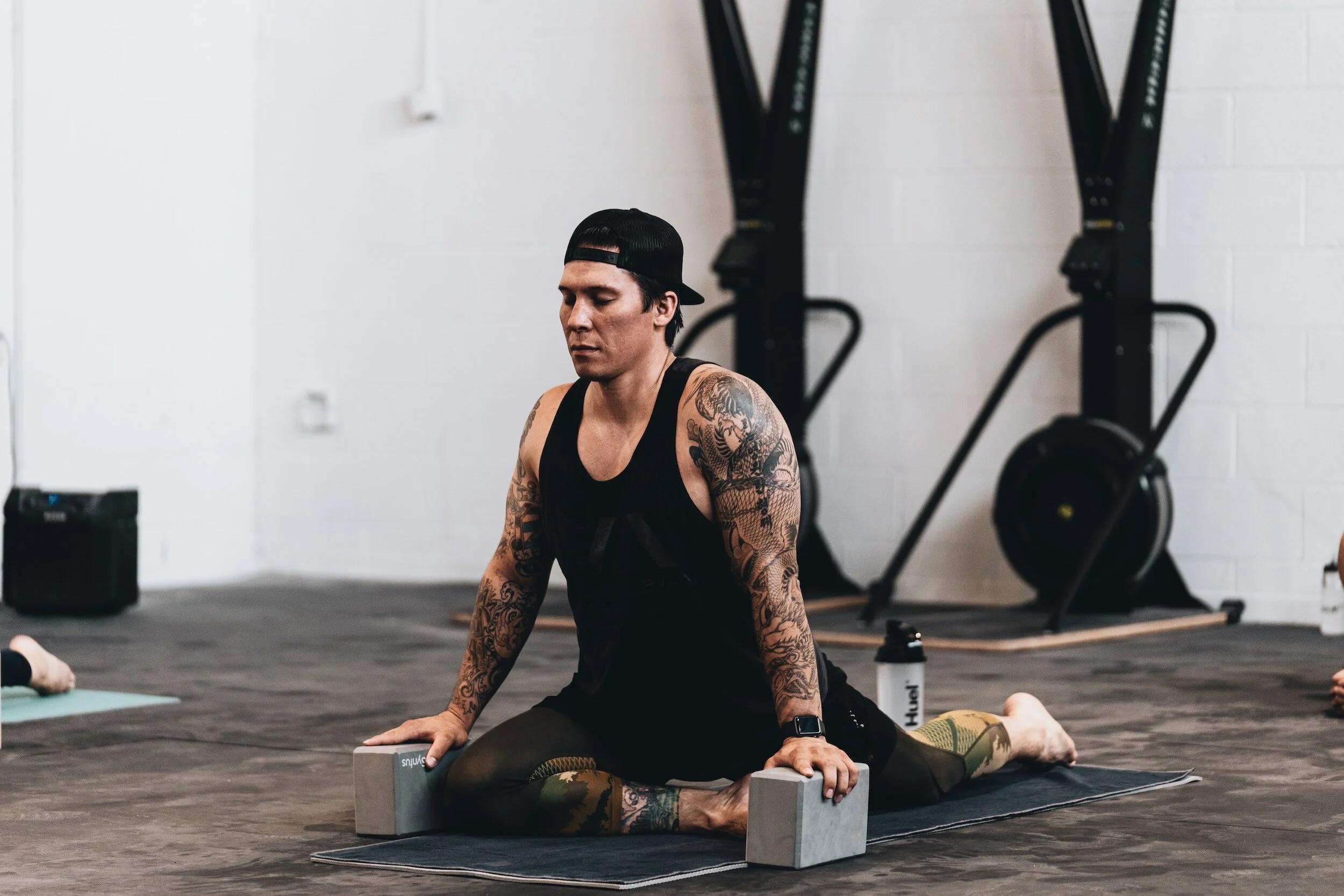 man stretching as part of his recovery program