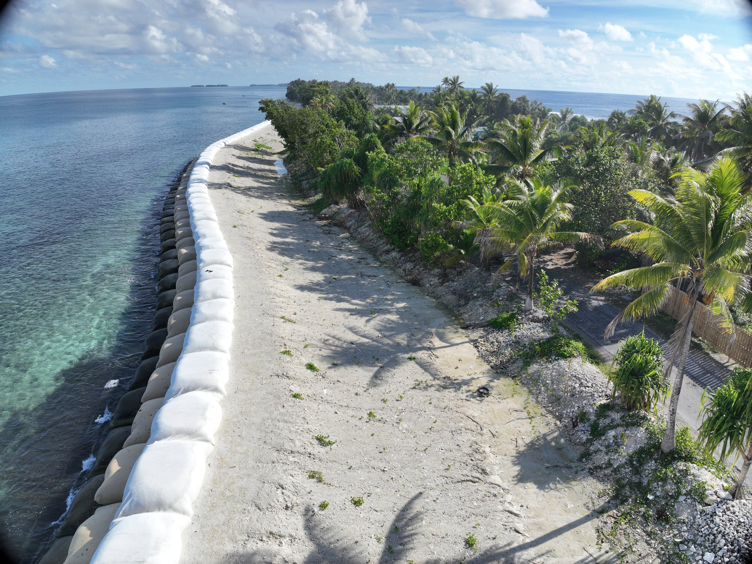 Geotextile coastal protection extending along the Akimoa lagoon shoreline in Northern Fogafale, Tuvalu.