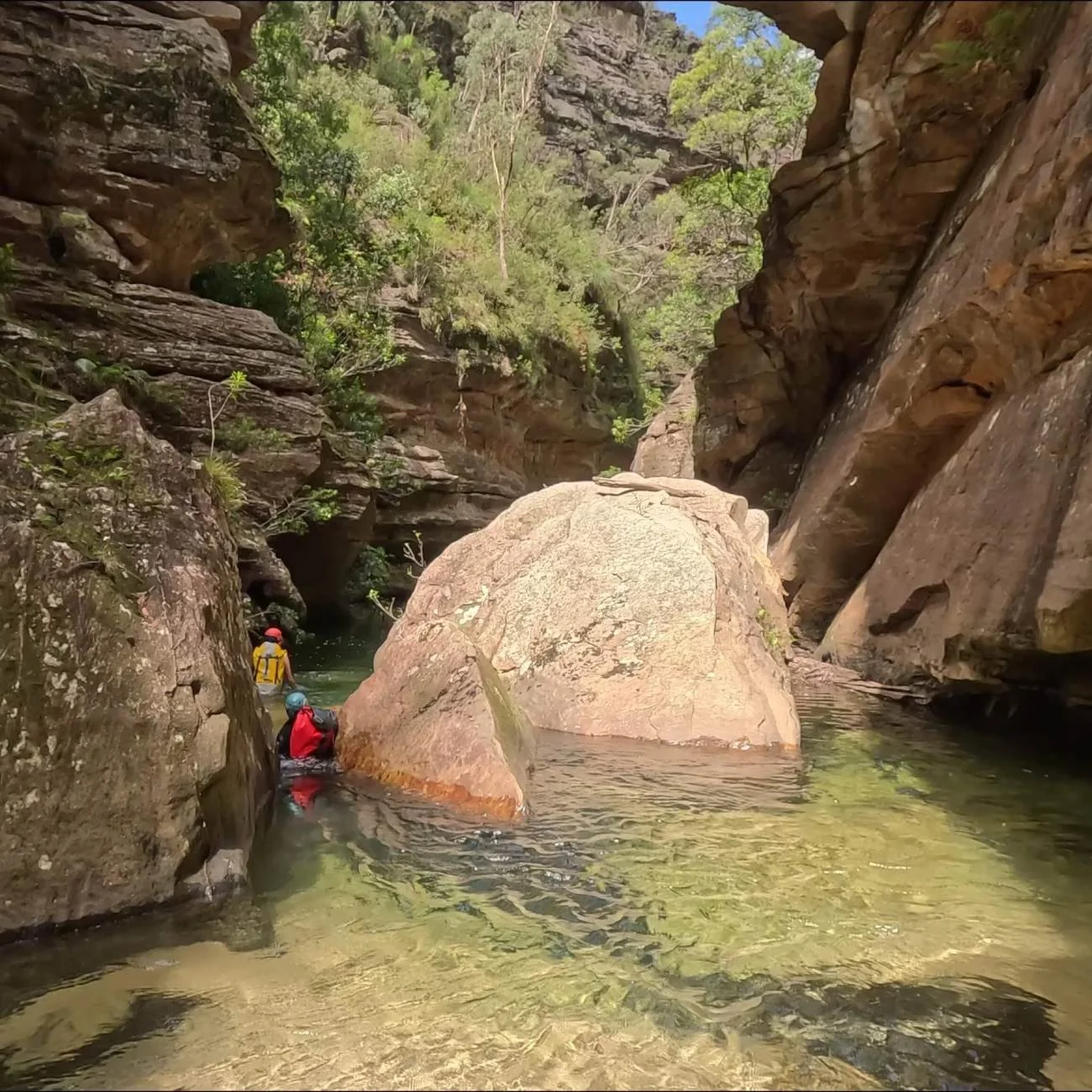 Two people with helments going through the Wollangambe 2 canyon
