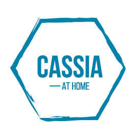 Logo with a blue hexagon outline and the text 'CASSIA AT HOME' inside
