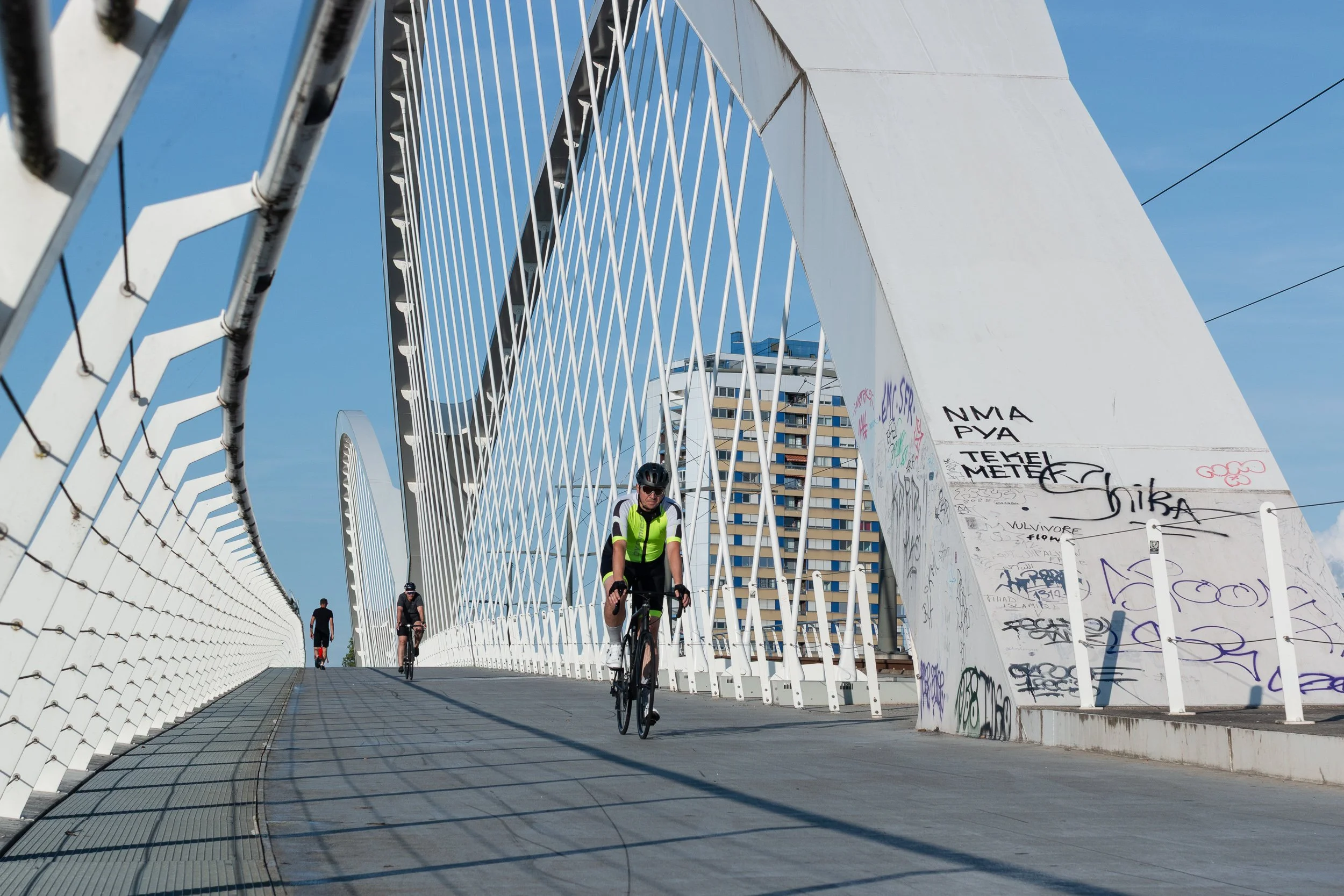 Cyclists crossing the Beatus Rhenanus Bridge, a cross-border pedestrian and bicycle bridge over the Rhine linking Strasbourg and Kehl.