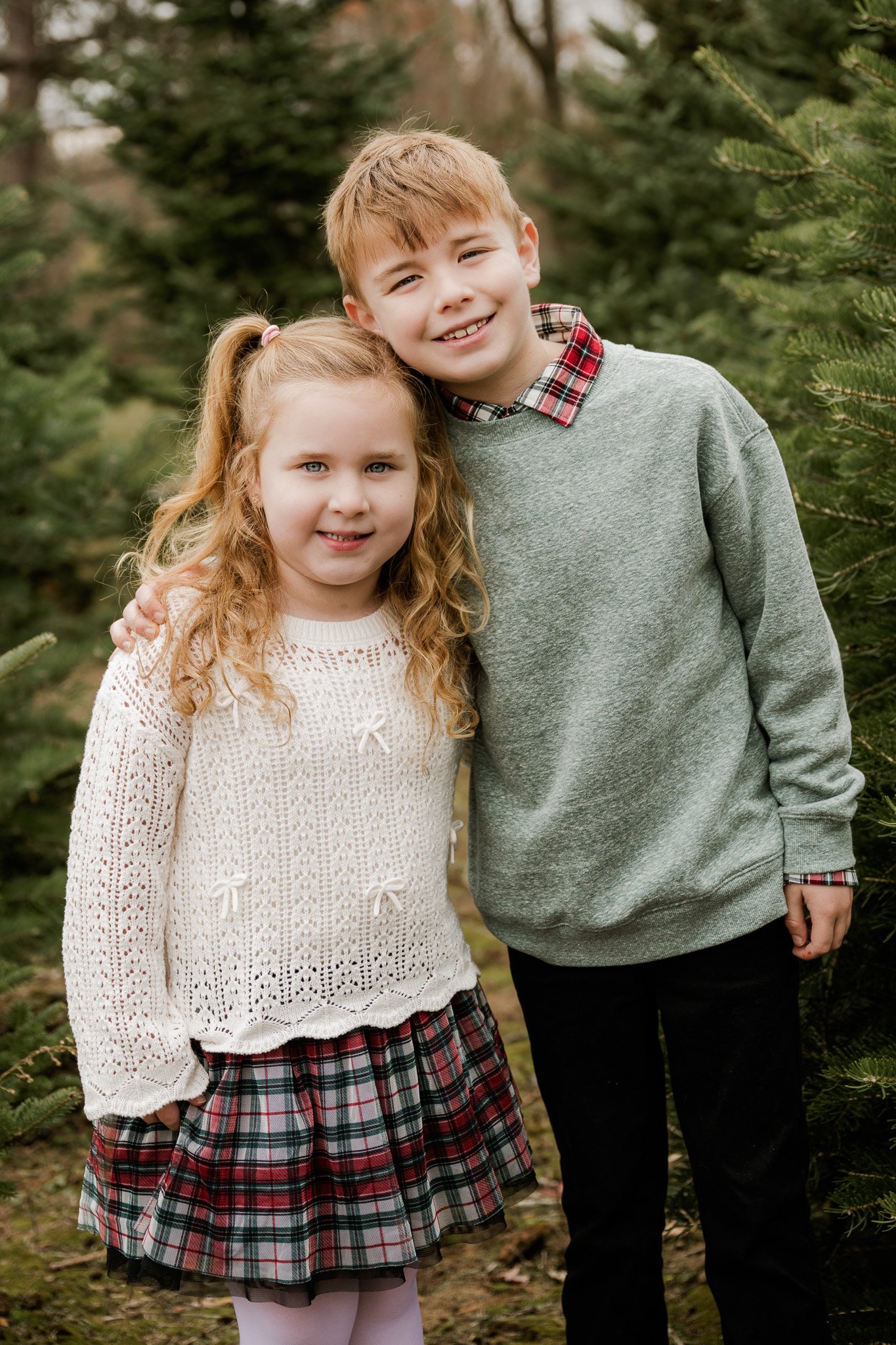 Family Christmas photos at a Christmas tree farm in Metro Detroit, photographed by Lore de Cosio Photography.