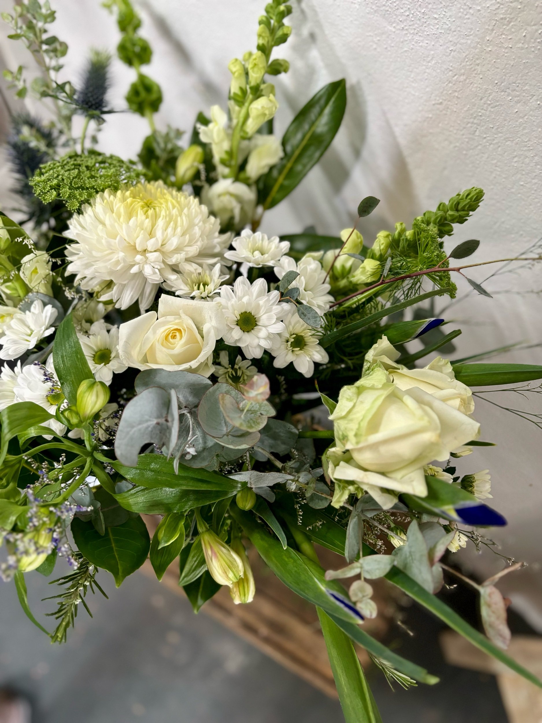 Locally grown white Roses, Snap Dragons, Sea Holly, Disbuds and Alstro