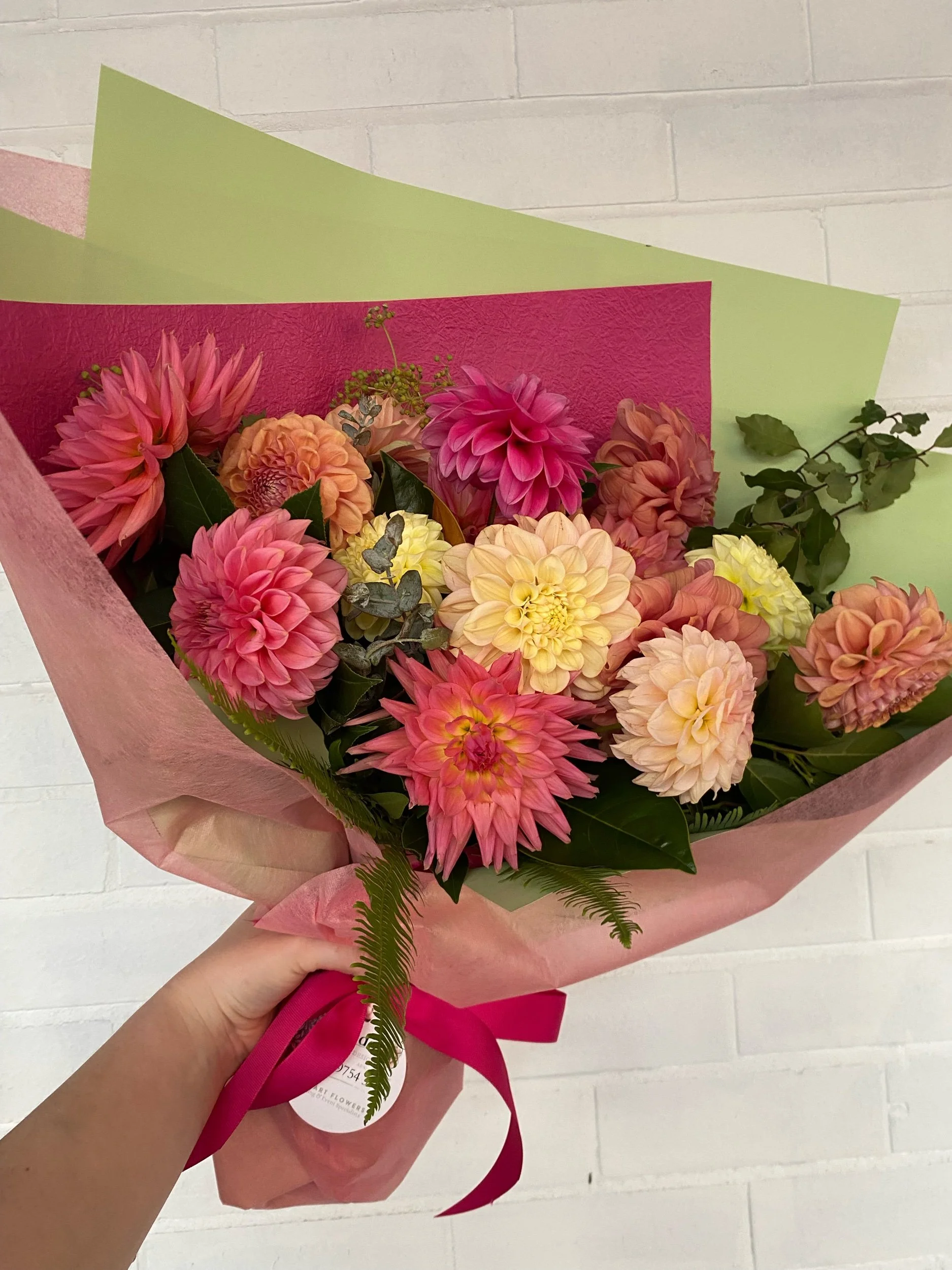 Dahlia bouquet in pinks, coral, peach and lemon tones