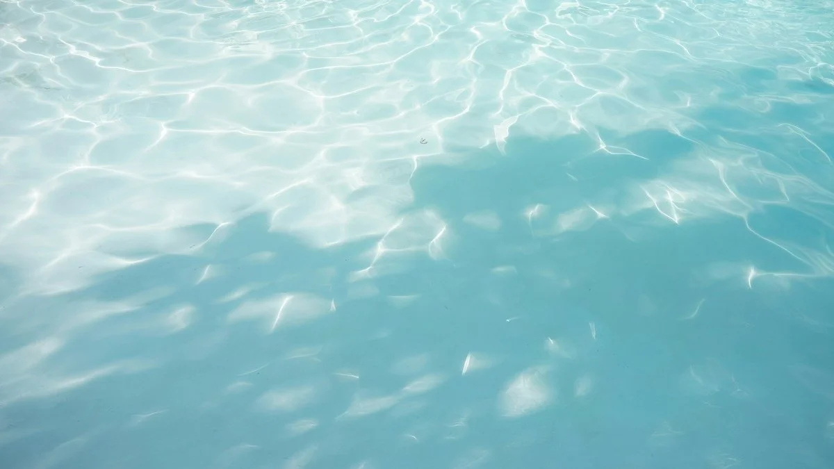 Watercolor painting with soft pastel shades of blue, purple, and pink blending together.