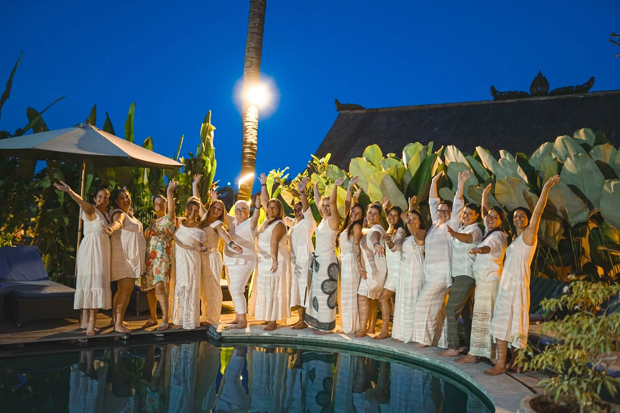 Group in white shot by pool Bali.jpg