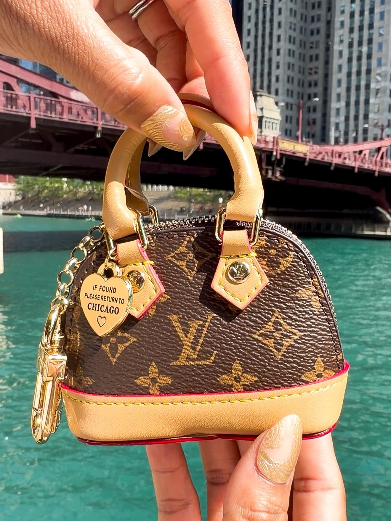 The bag may be designer&hellip; but the charm is the one getting all the compliments. 😉🤎
If found, please return to Chicago.
✨ Available at the Lunairi Charm Bar