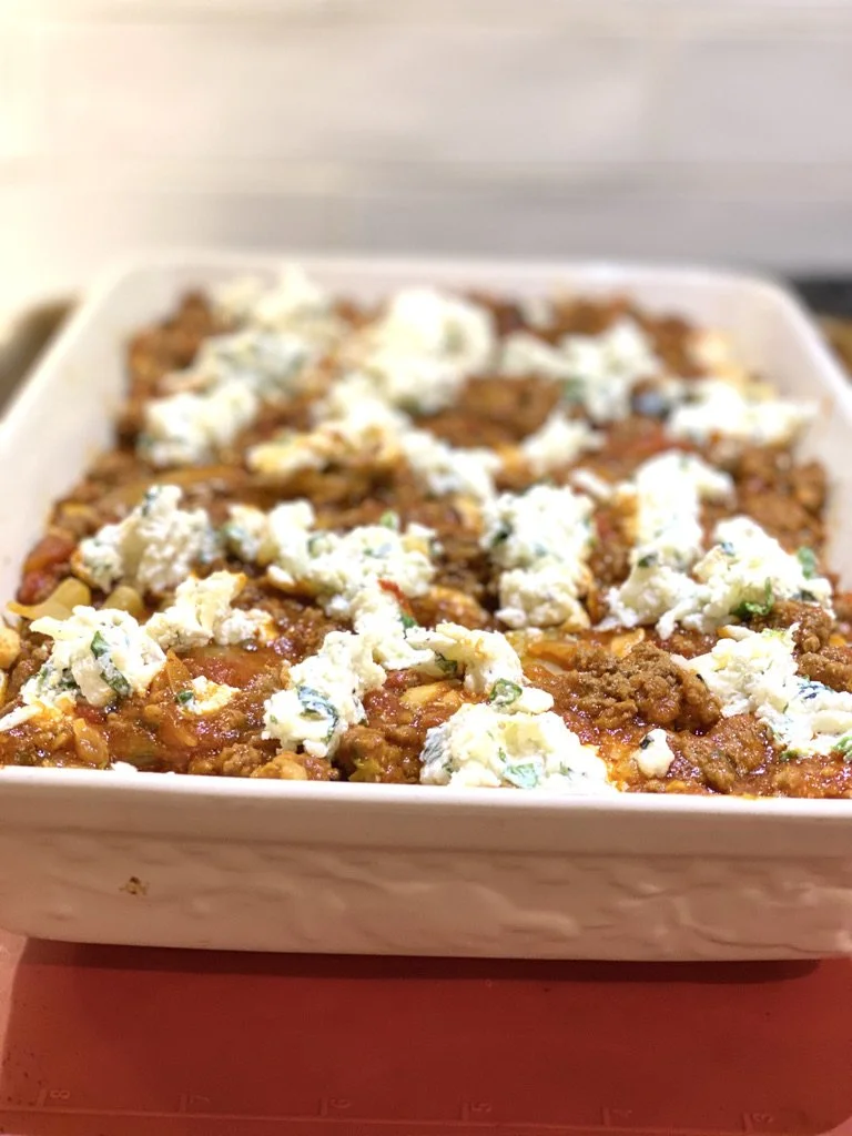 This lasagna recipe makes 2 huge lasagnas so your future self will have one ready to go when needed.
