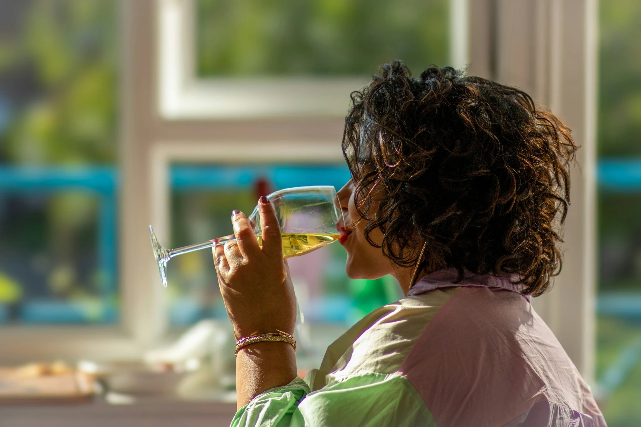 woman in perimenopause enjoying wine