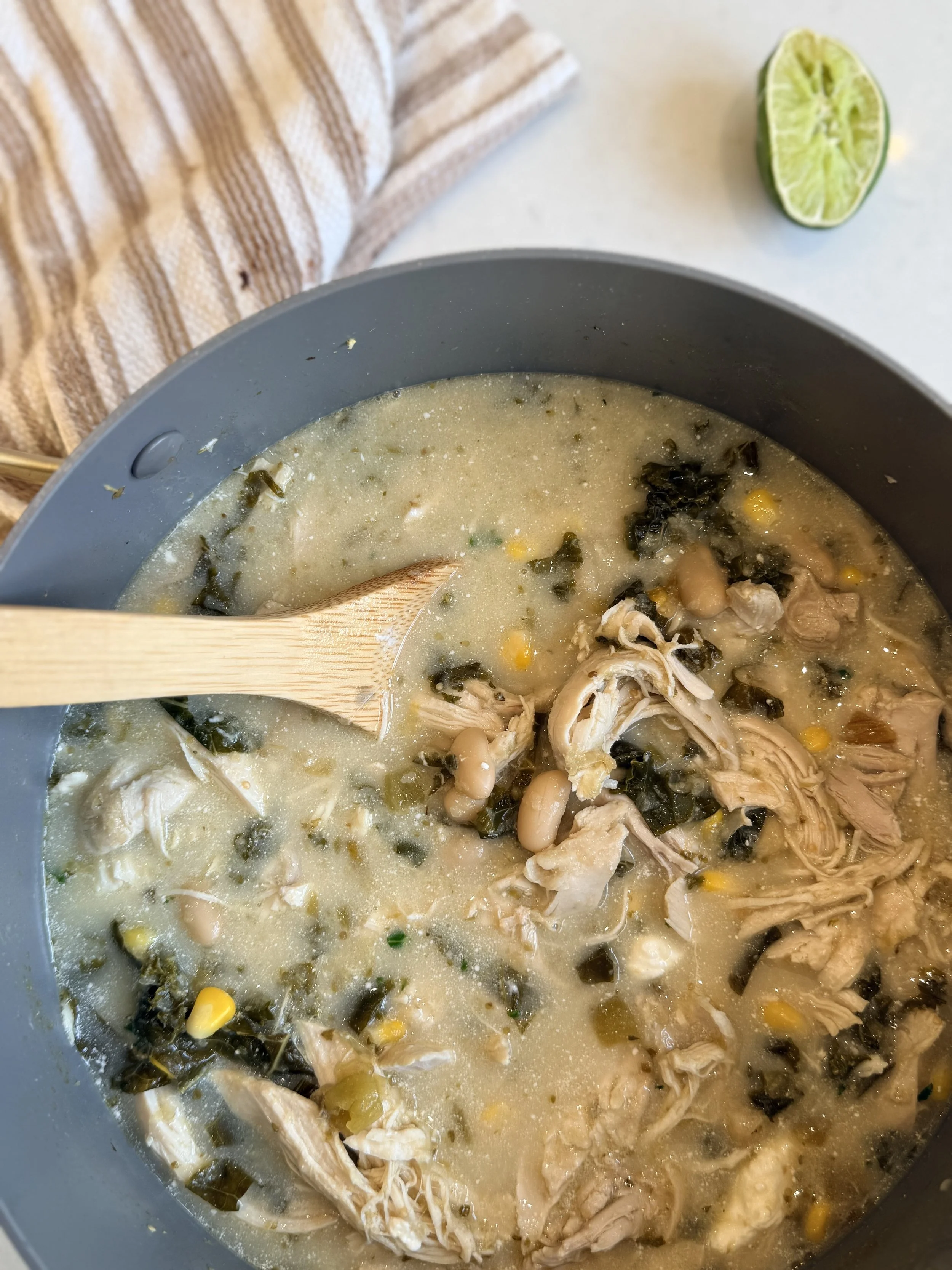 a hearty and creamy chicken enchilada stew