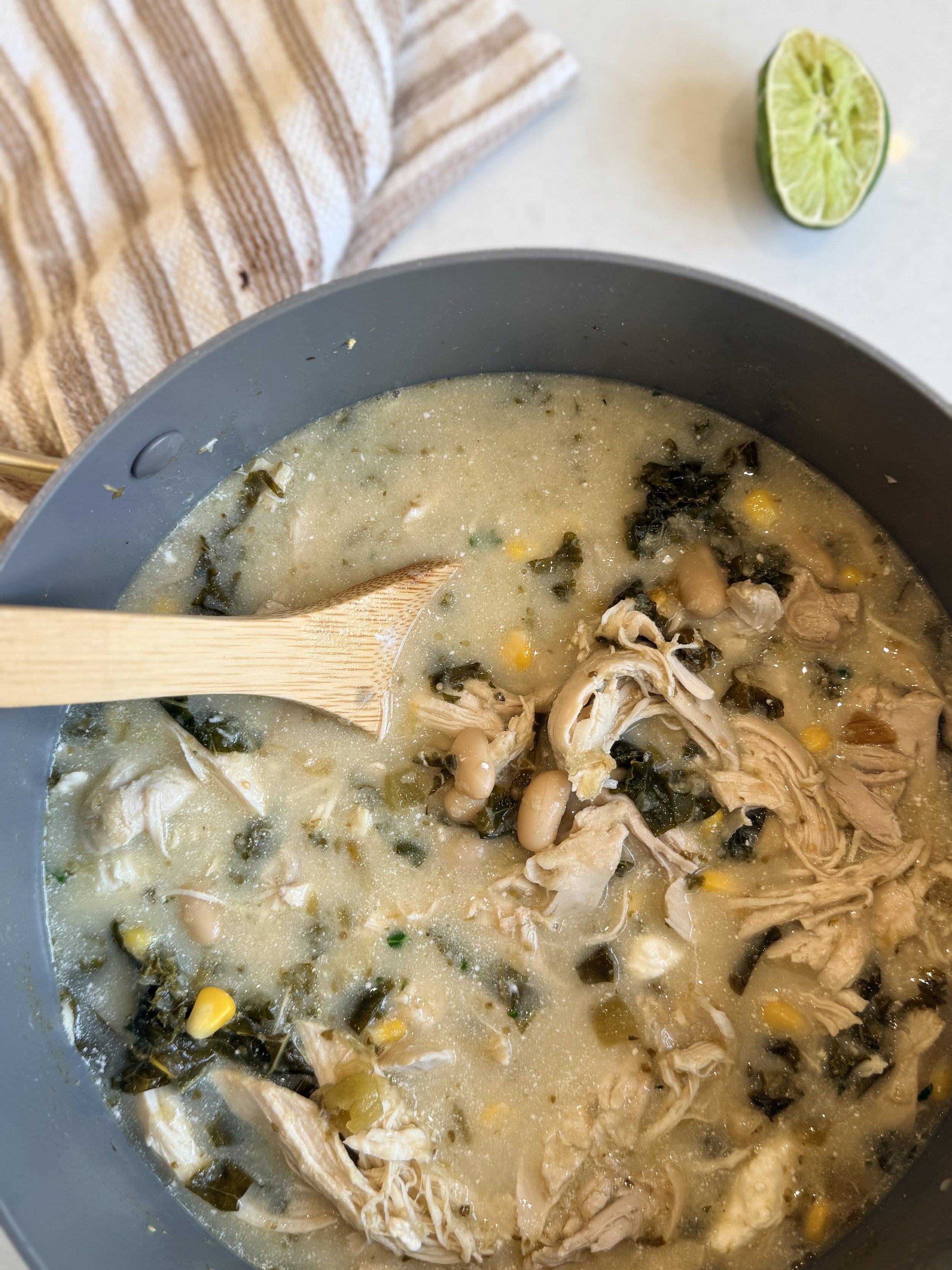 a hearty and creamy chicken enchilada stew