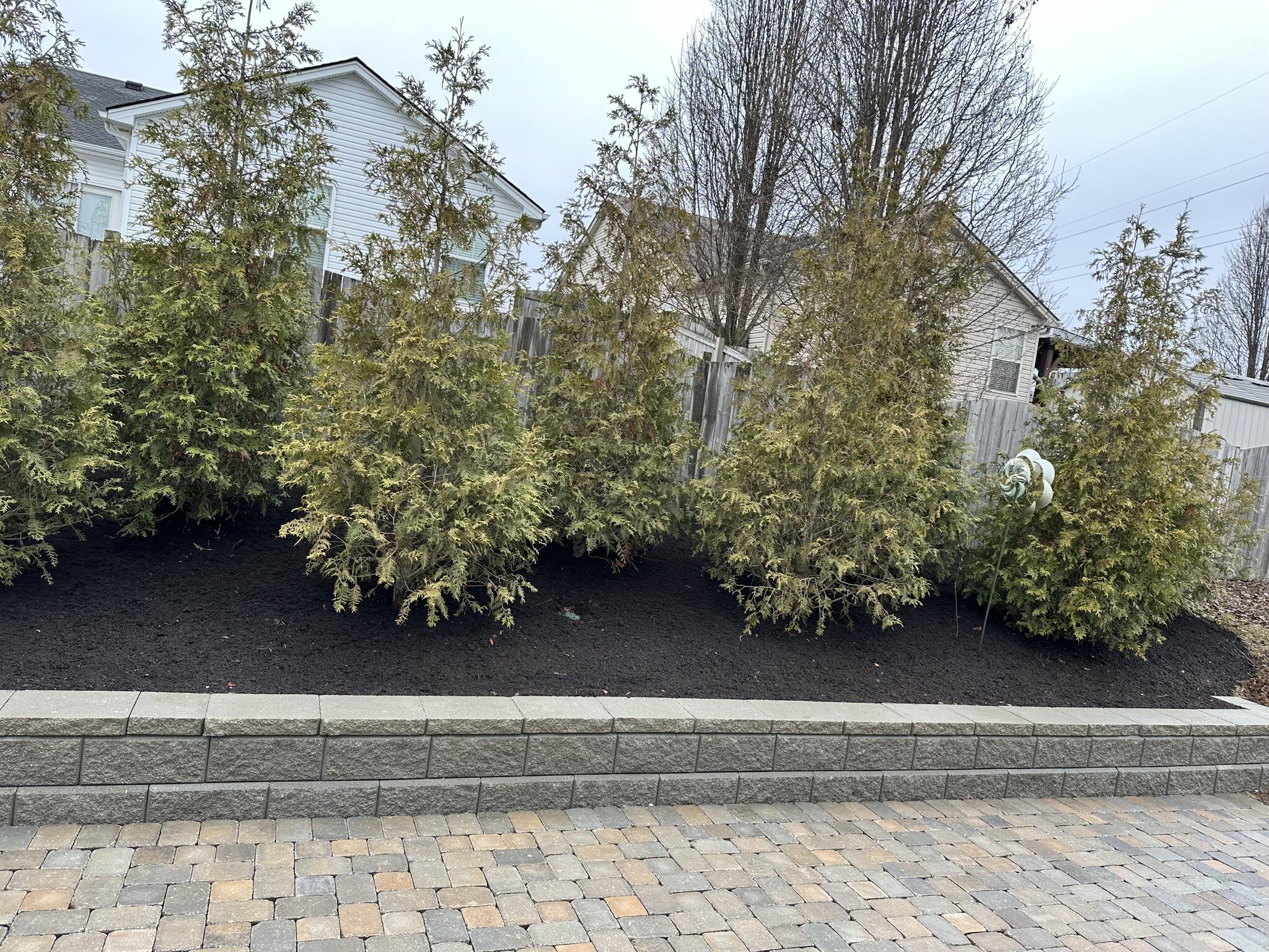 A simple sit wall next to a patio allows for extra seating during larger gatherings. Enjoy the added space. 

#retainingwall 
#landscapedesign 
#sitwall 
#paverpatio 
#screeningwithtrees