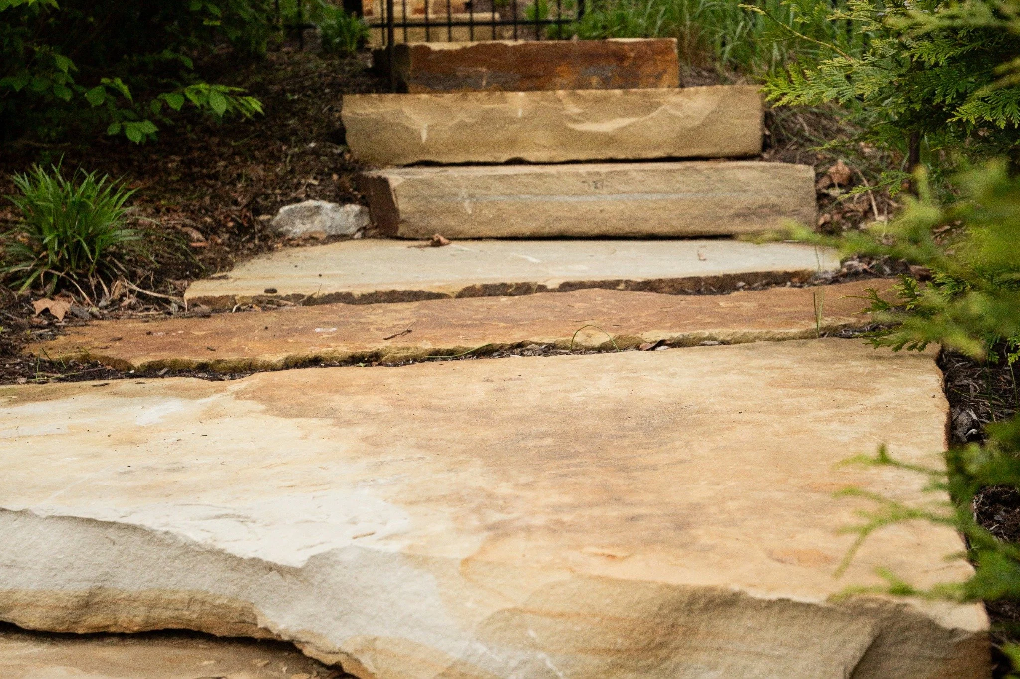 Your outdoor space works best when every detail has a purpose.

From proper drainage and grading to shade structures, landscape lighting, natural stone steps, and fire features, the small elements are what shape a backyard that feels effortless to li