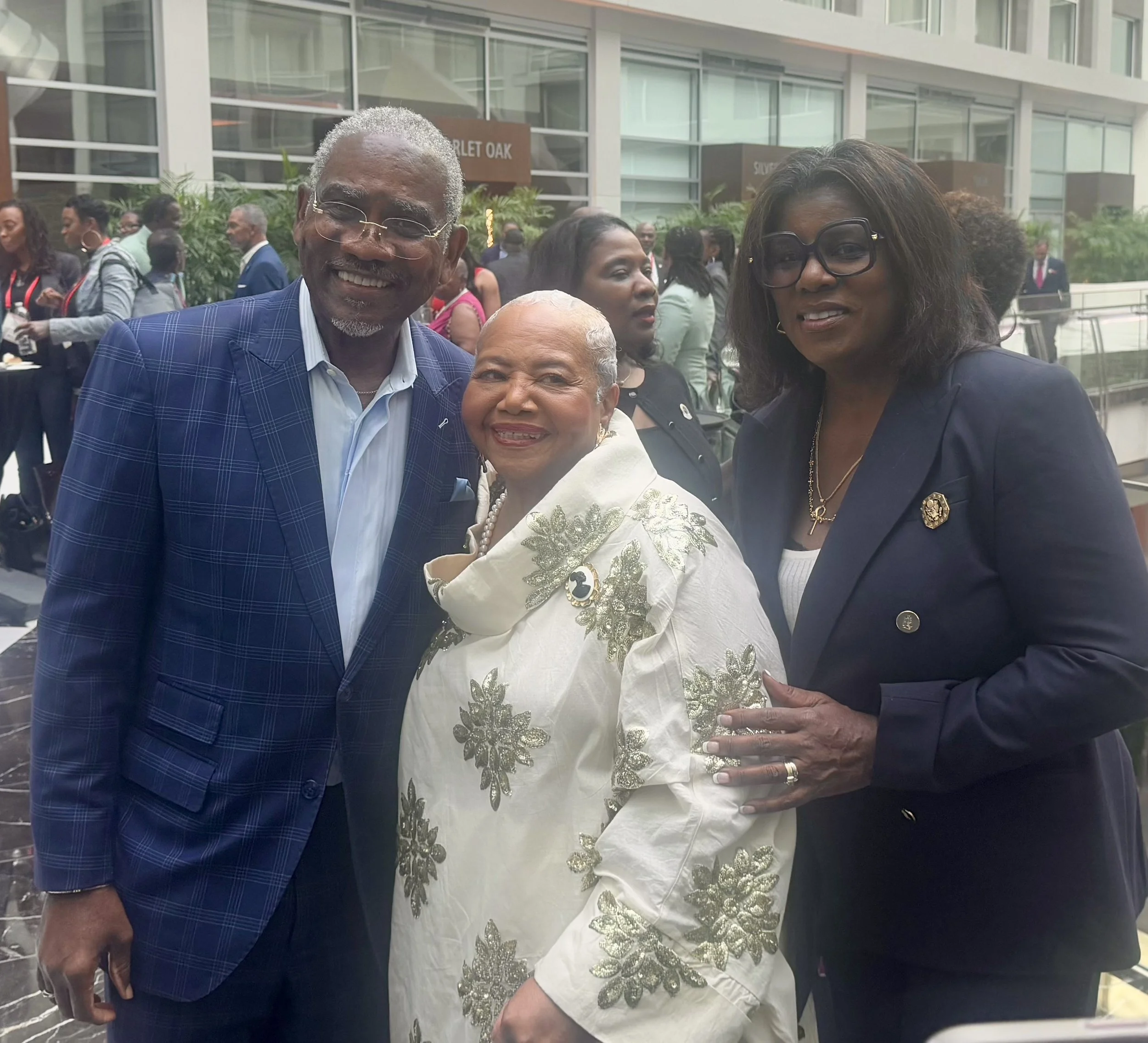 Debra Fraser-Howze with Rep. Gregory Meeks and Simone Meeks