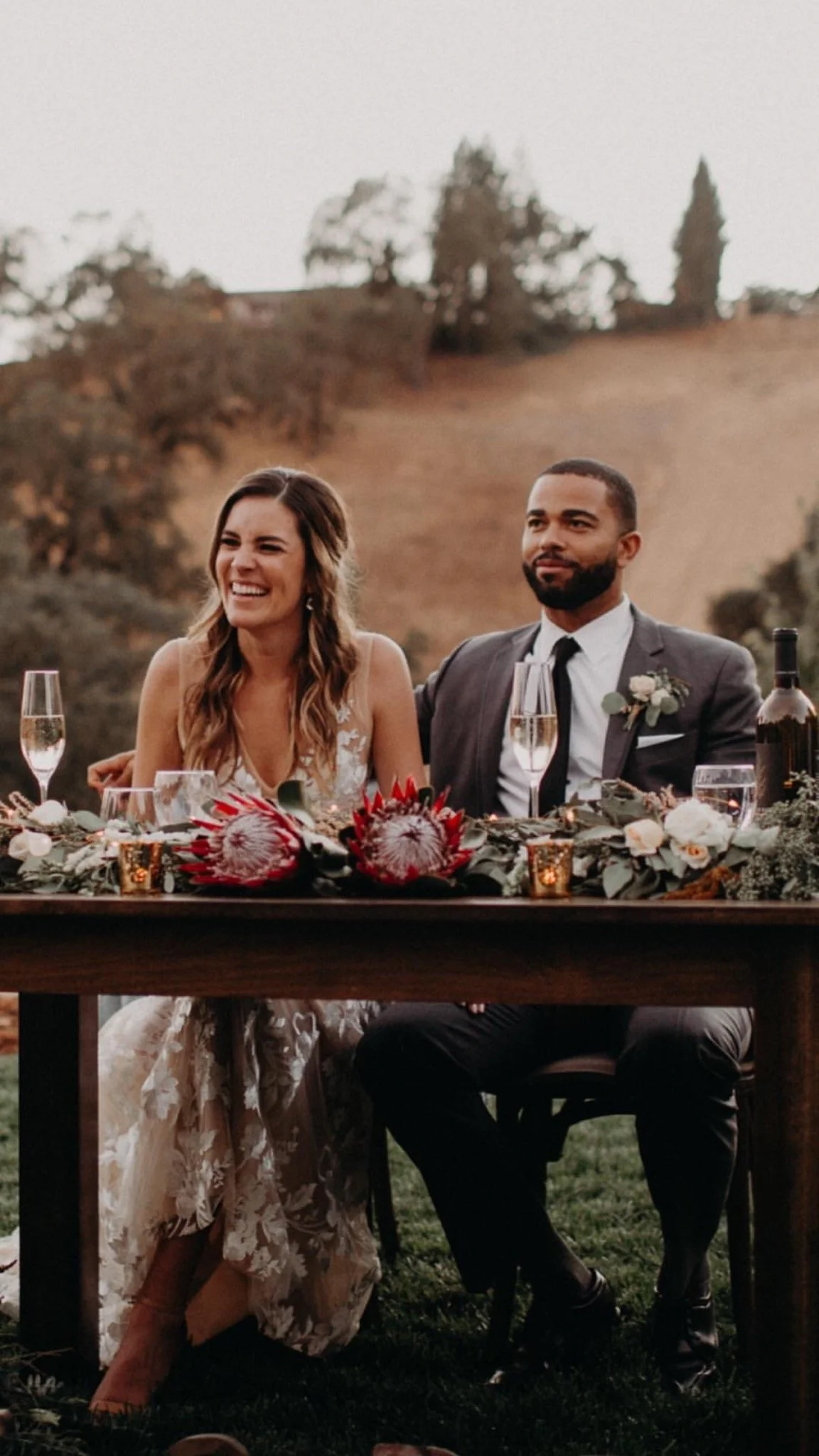 Laurie’s customers, Fernando and Kate embracing by the lake on their wedding day.