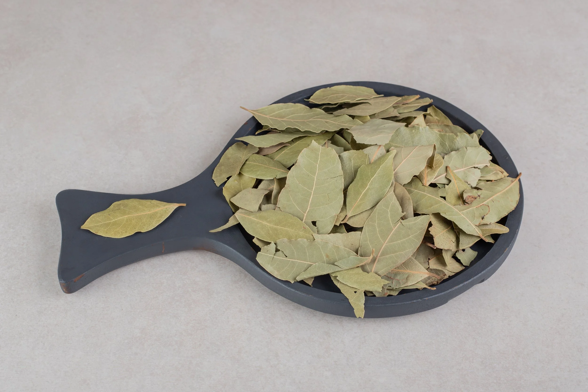 dried-green-bay-leaves-wooden-platter.jpg