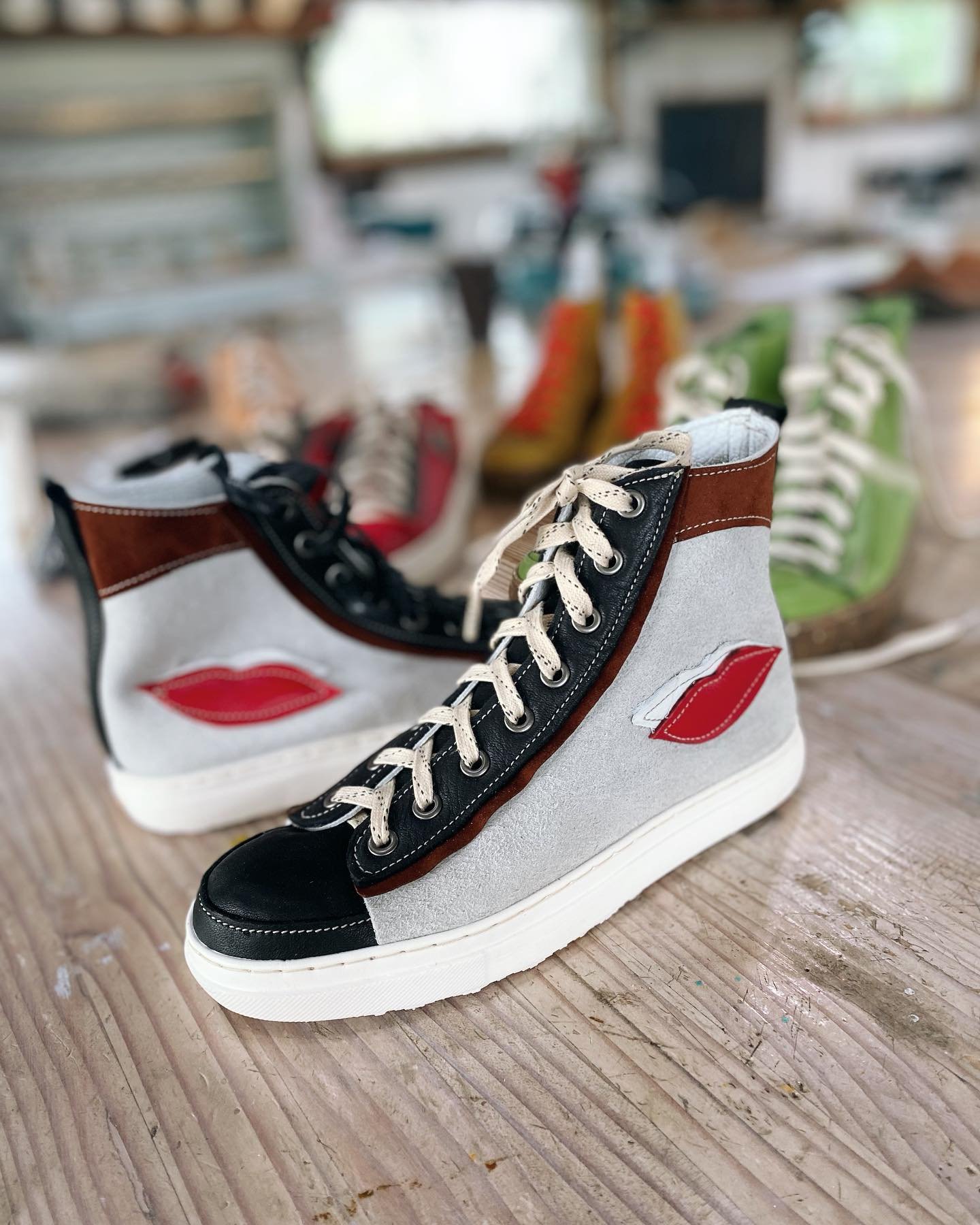 This pair of high tops are sealed with a kiss. What a great design. #coloradoshoeschool, #thingstodoinftcollins , #handmadeshoes, #bellvuecolorado