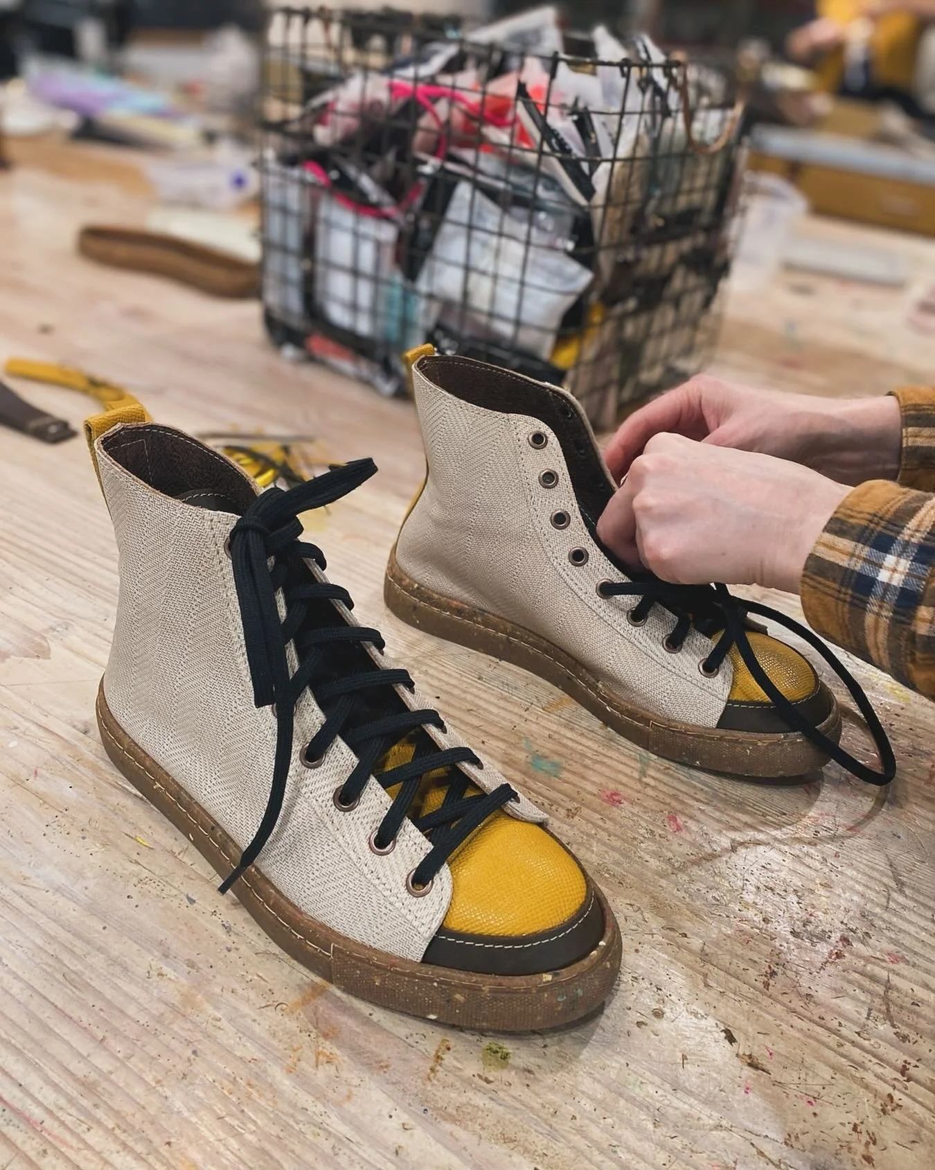 Robin made these high tops today. Her design is inspired by the meadow lark. #coloradoshoeschool, #learntomake