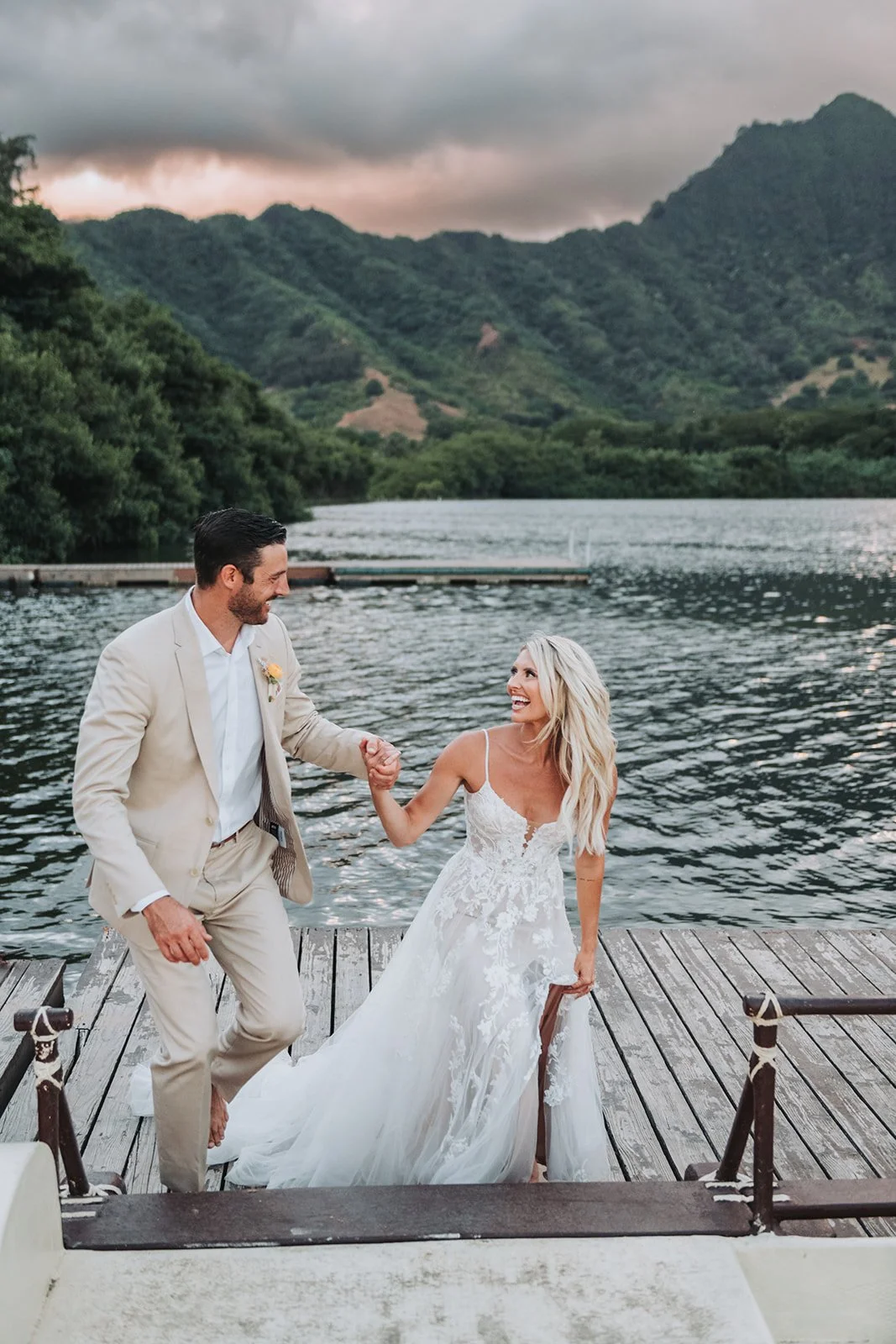 unposed-couple-walking-on-dock-mountain-lake.jpg