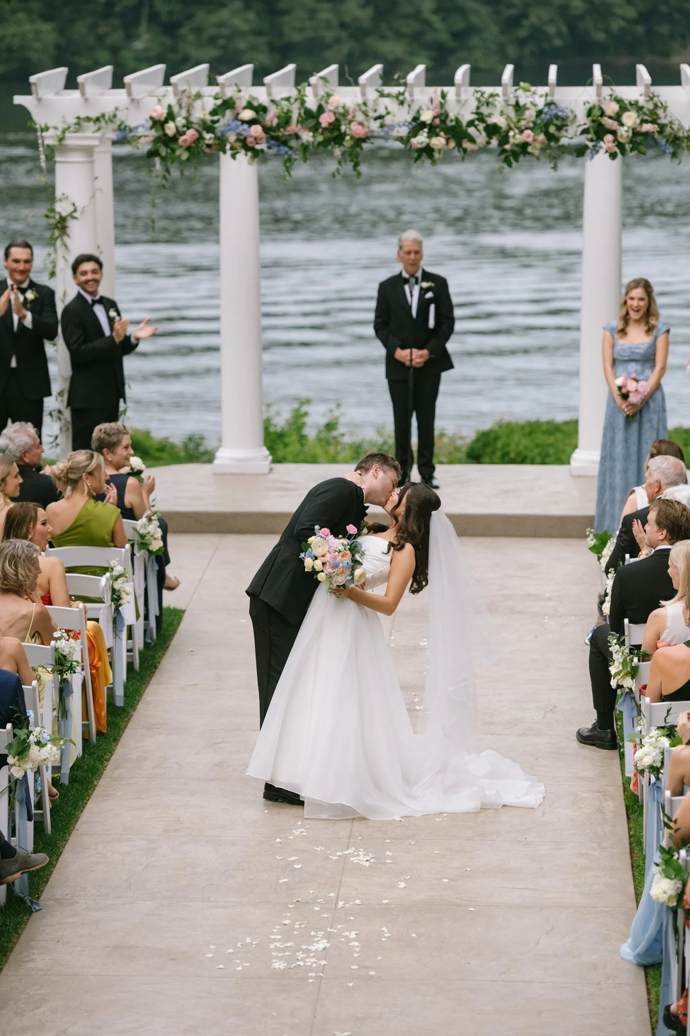 documentary-style-first-kiss-at-waterfront-ceremony.jpg