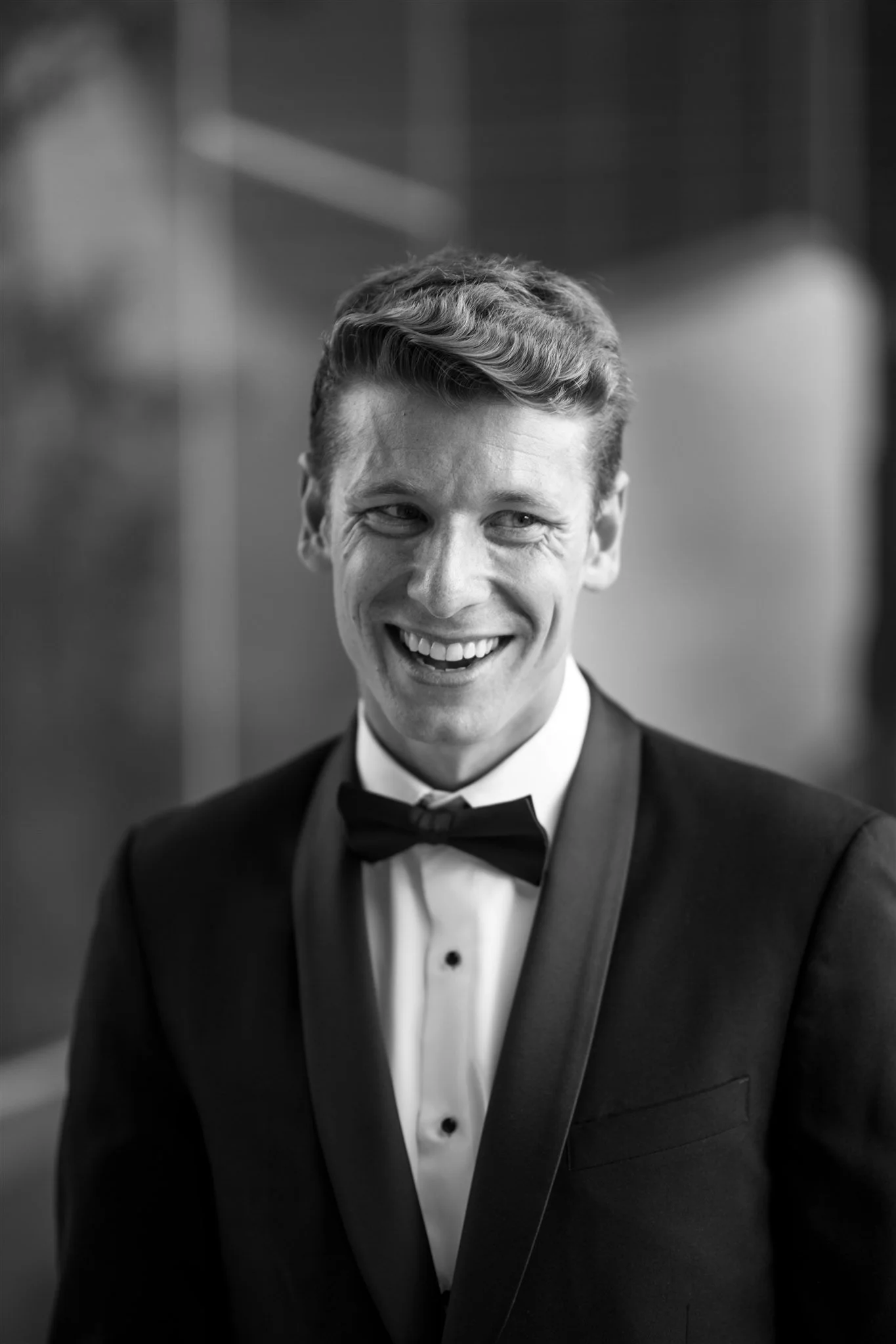 groom-portrait-smiling-black-and-white.jpg