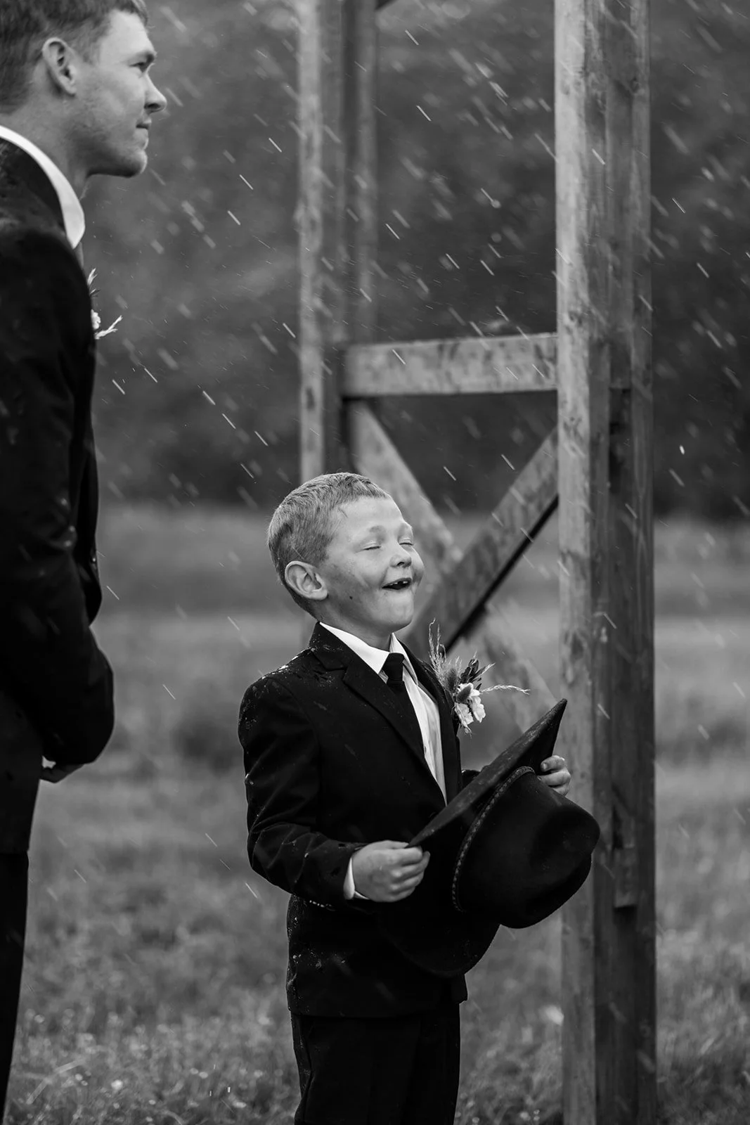 candid-ring-bearer-laughing-in-rain-black-and-white.jpg