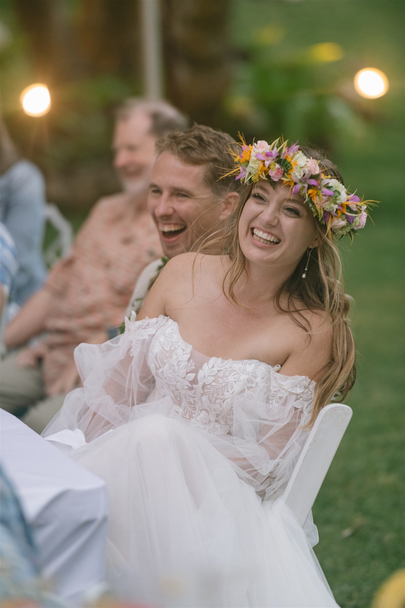 candid-bride-flower-crown-laughing-with-guests.jpg
