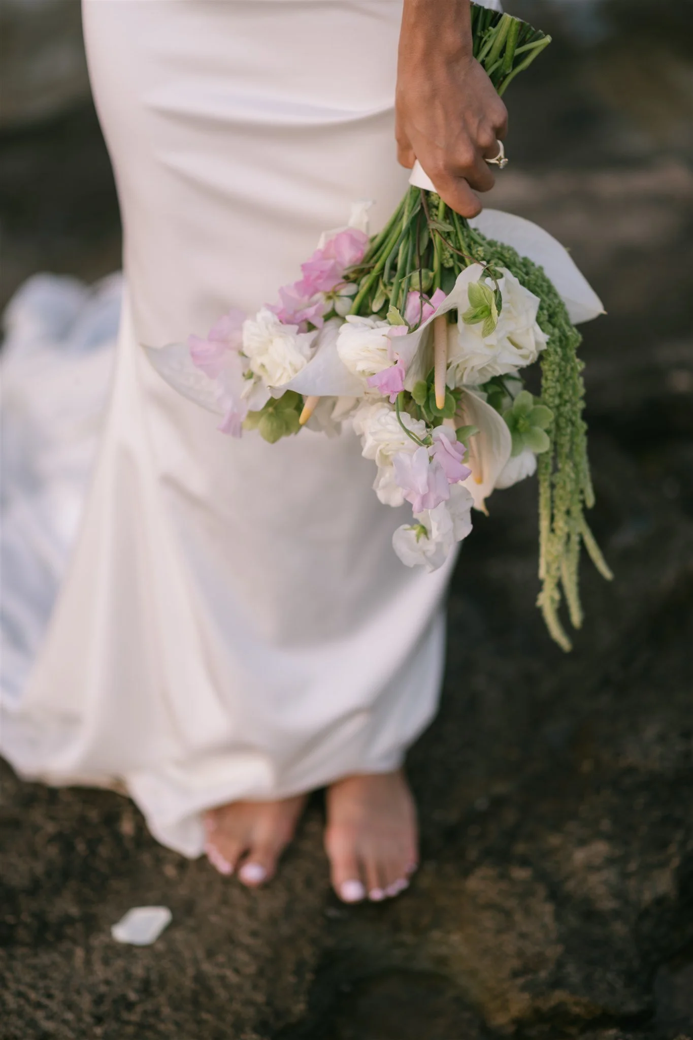 barefoot-bride-holding-bouquet-detail.jpg