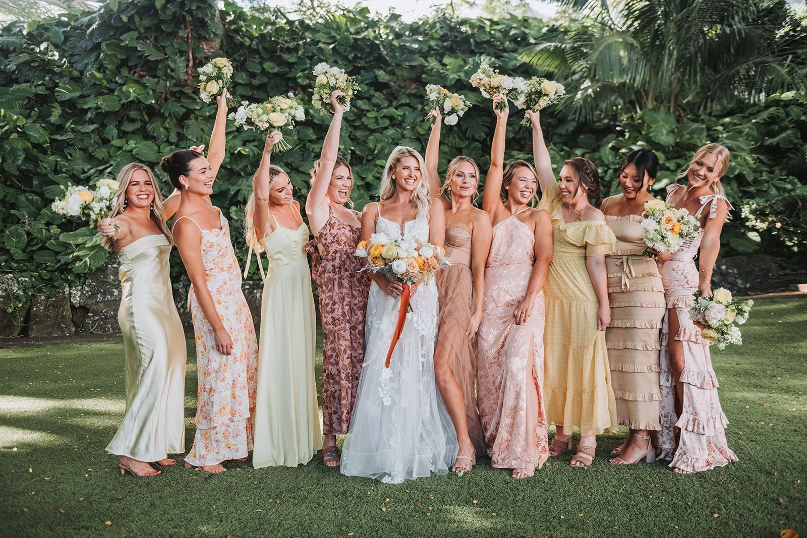 bridesmaids-cheering-with-bouquets.jpg