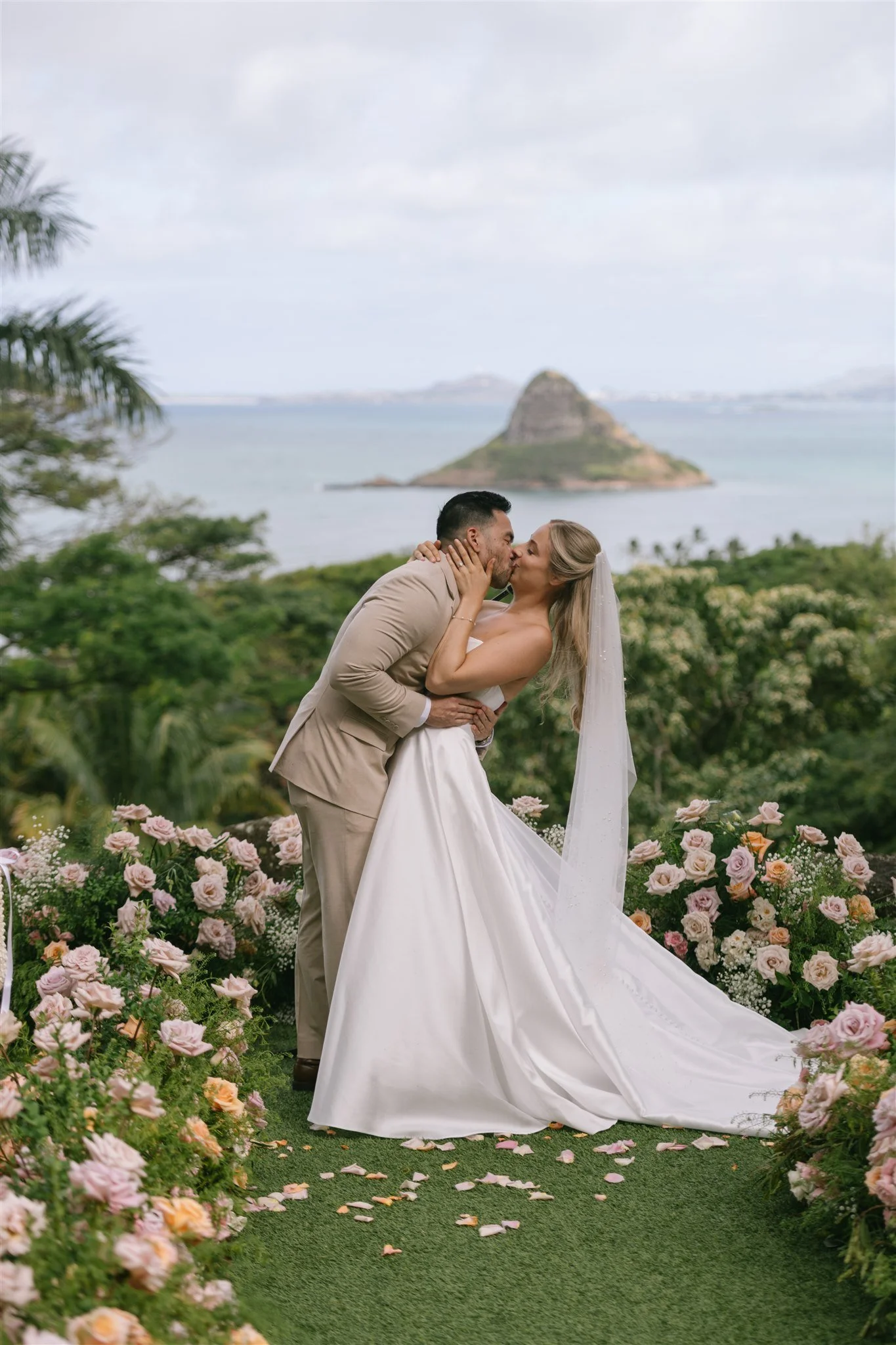 couple-kiss-in-rose-garden-ocean-view.jpg