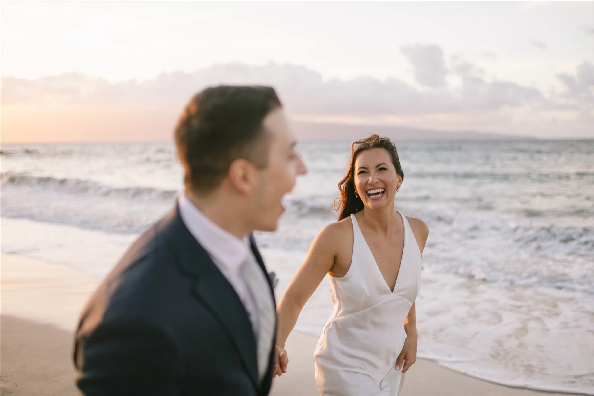 candid-couple-laughing-on-beach.jpg