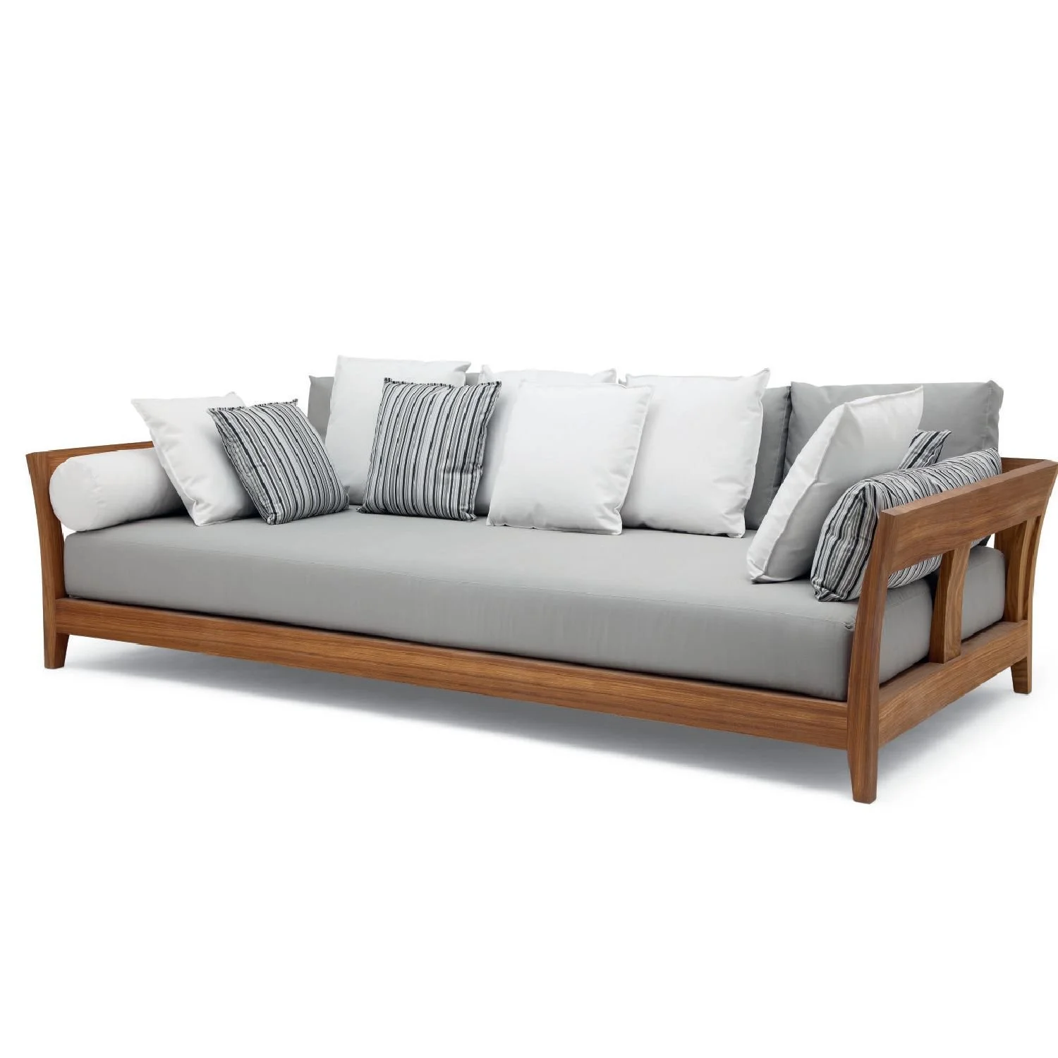 A modern wooden sofa with light gray cushions and multiple white and striped accent pillows.