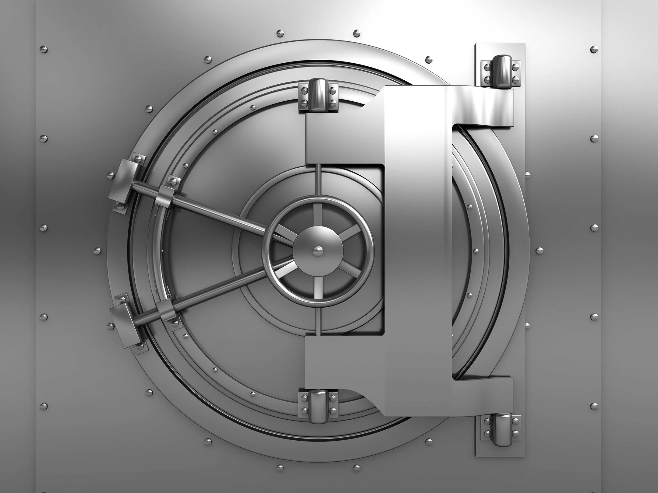 Close-up of a large, heavy steel vault door with a combination lock mechanism, bolts, and locking bars.