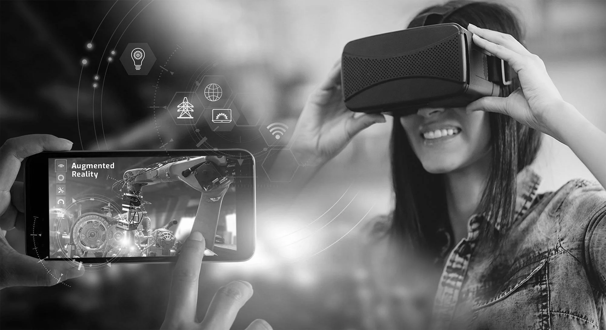 A young woman is smiling and wearing a virtual reality headset, while another person is holding a smartphone with an AR app showing a 3D model of a robot and overlayed icons related to augmented reality technology.