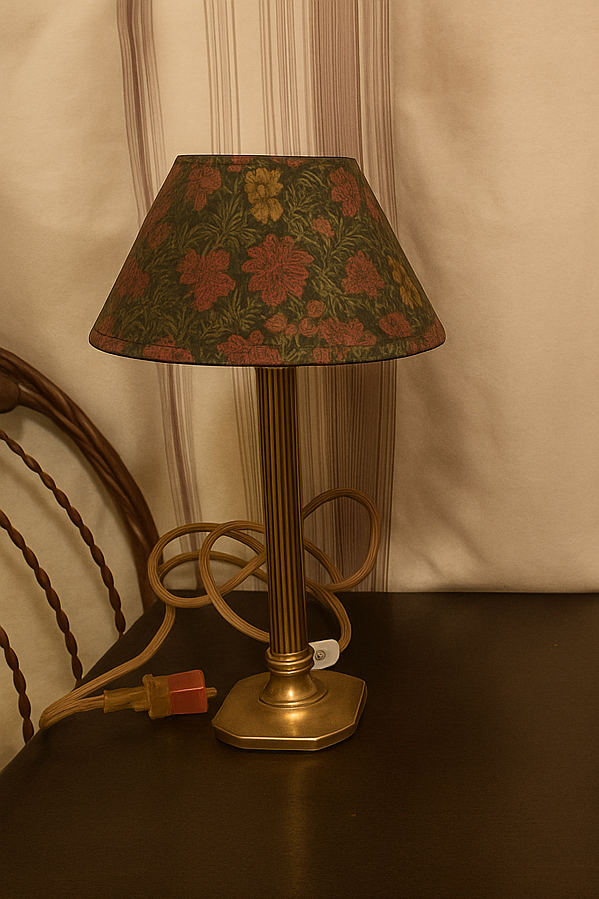 990s vintage brass floral table lamp — elegant retro lighting with a warm glow and patterned shade, styled against striped wallpaper for a nostalgic mid-century look.