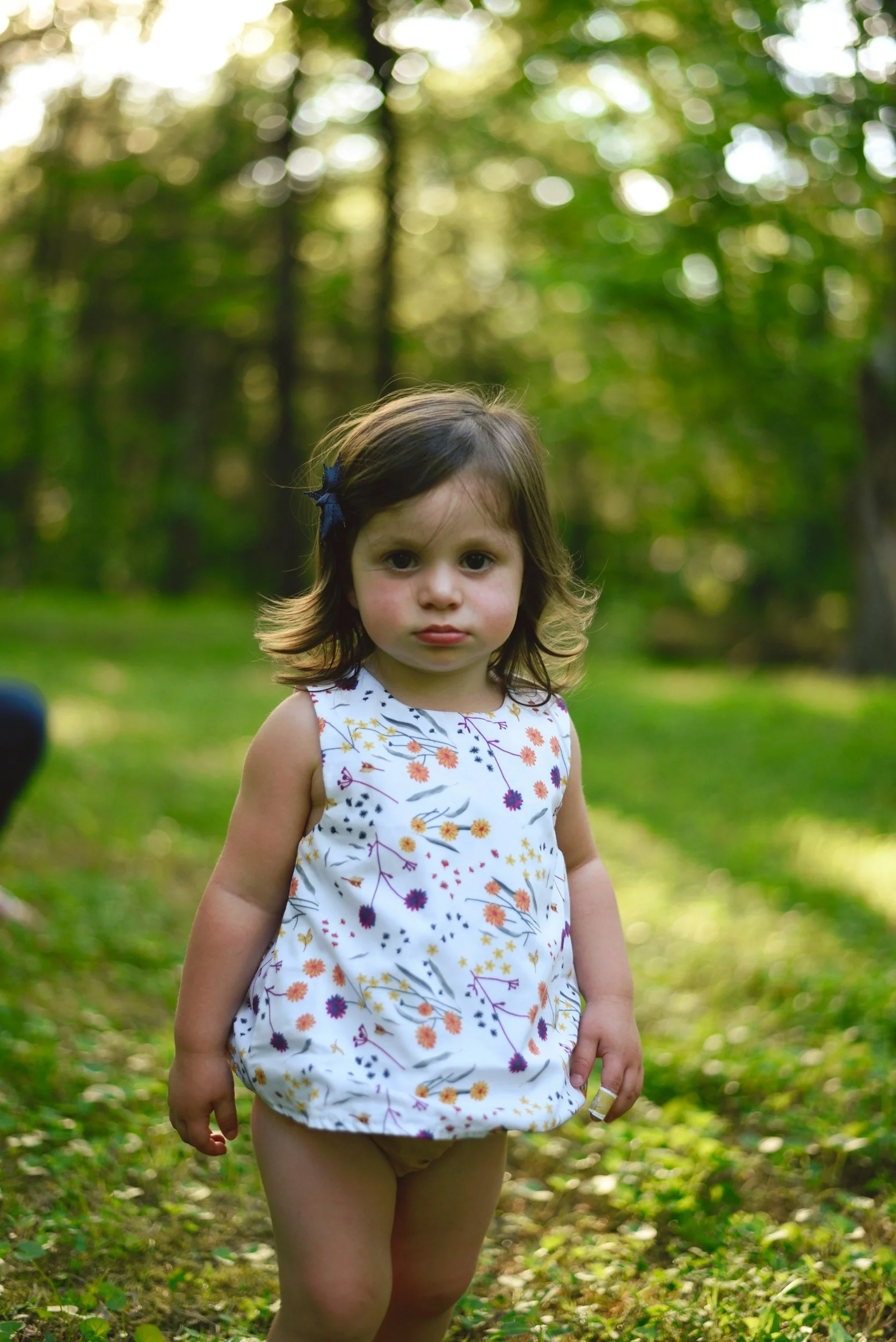 two year old girl with upset expression because she is in the terrible twos