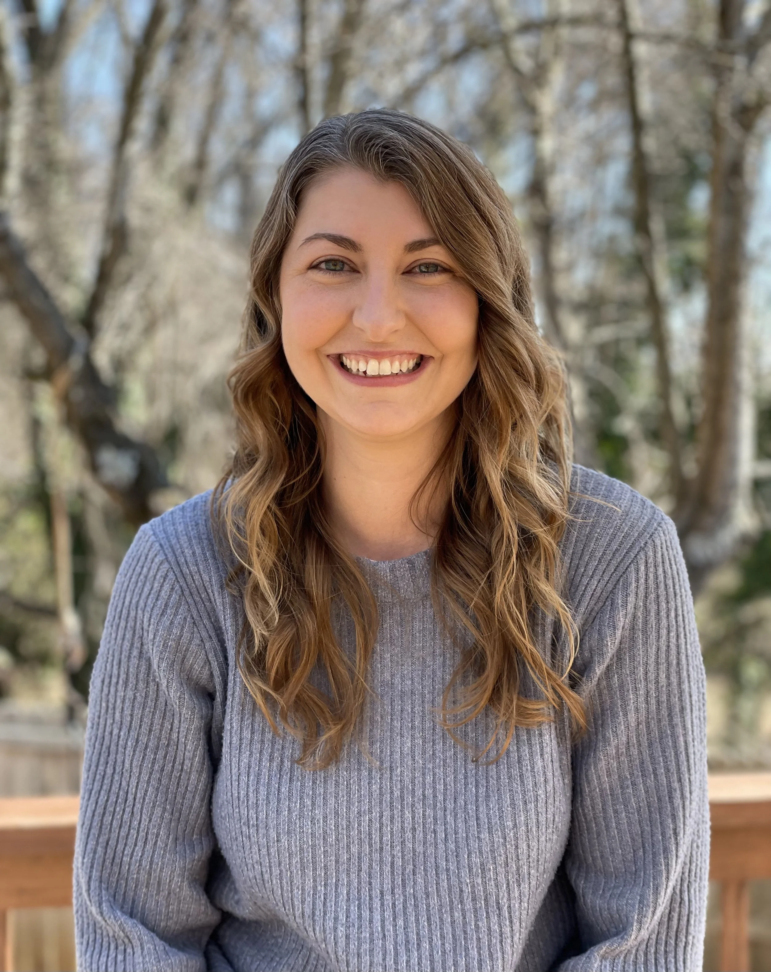 headshot of sara alexander therapist at well roots counseling