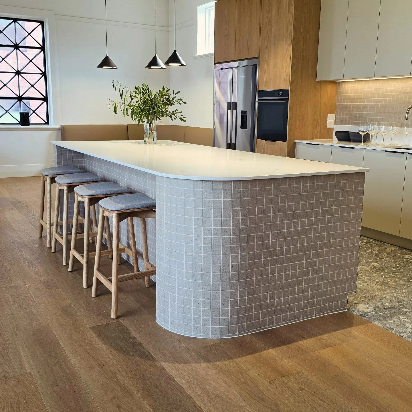 This is the perfect way to utilise 50mm porcelain mosaics. They accentuate the features of the island and can be wrapped around curves while holding integrity on a mitred edge. Personally this was my favourite room in the build. Tiled over 2 days and