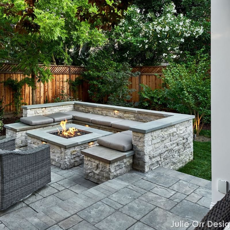a stone fire pit and seating area