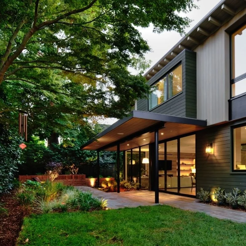 a lush backyard with a patio