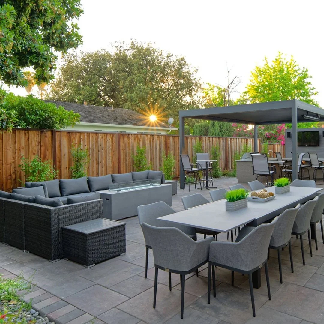 A neatly constructed flagstone patio with clean gravel walkways and contemporary outdoor seating.