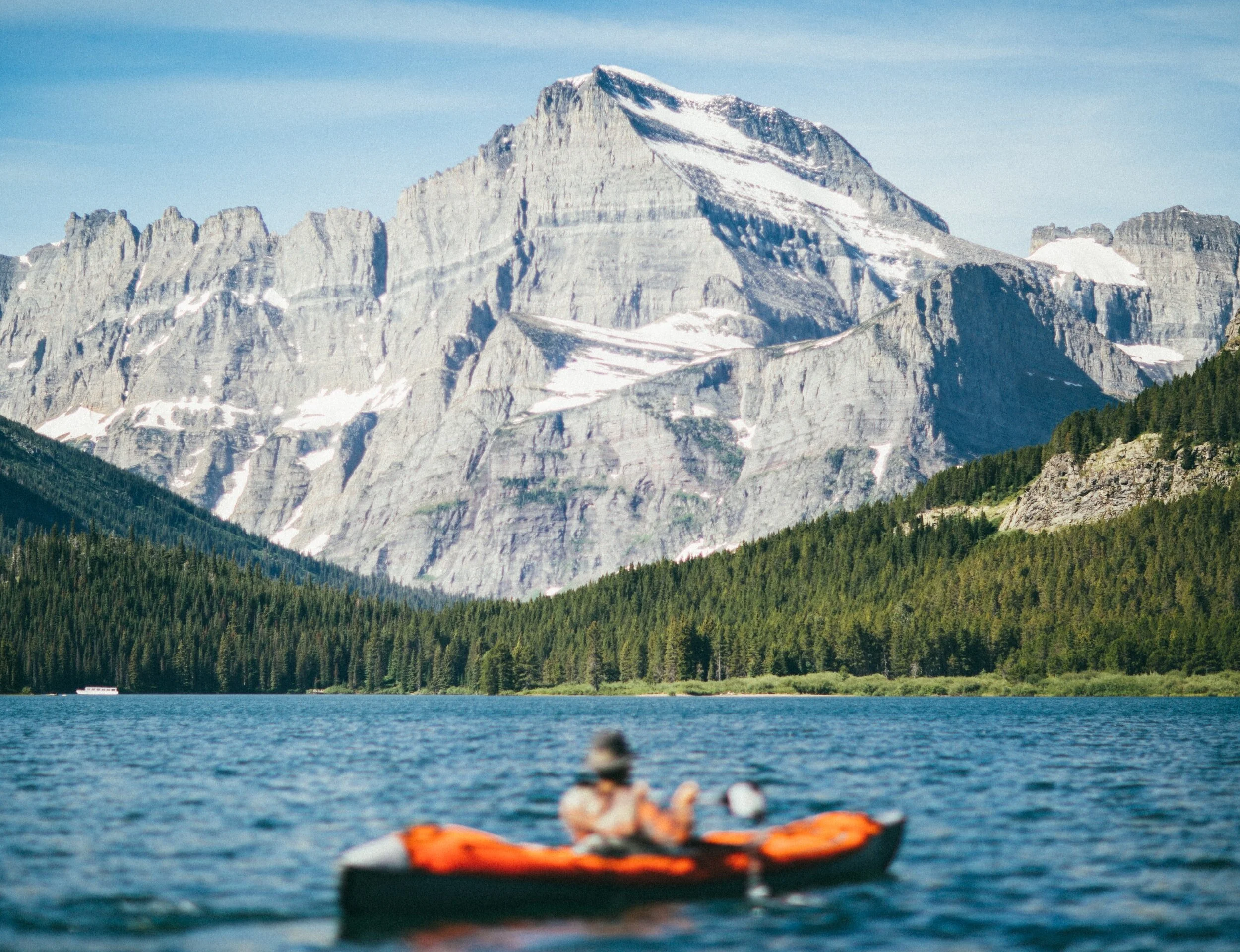 kayaking with a view of the mountains