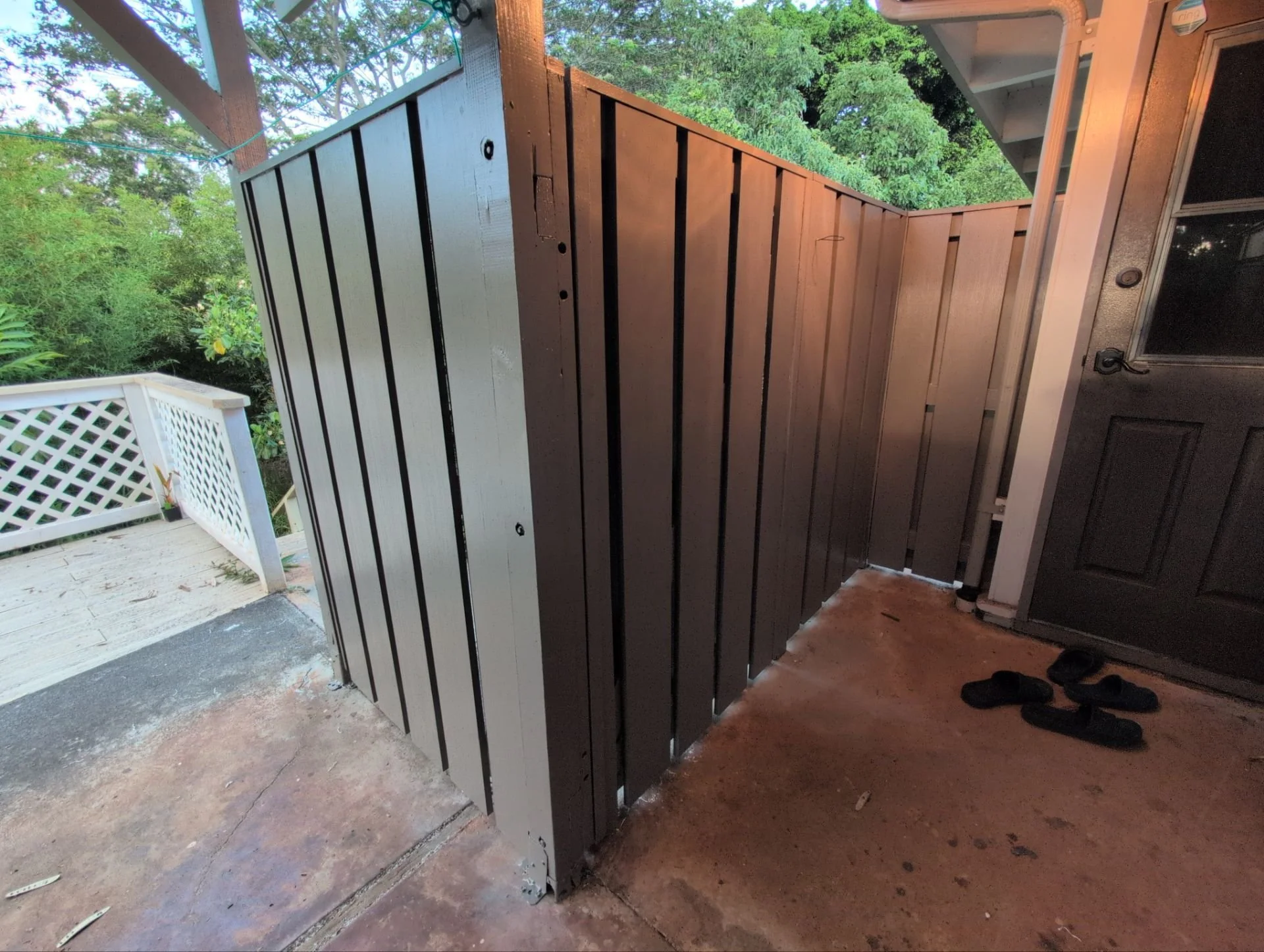 Wooden fence rebuilt using pressure treated lumber, PVC slats / top cap, plus primer & 2 coats of paint