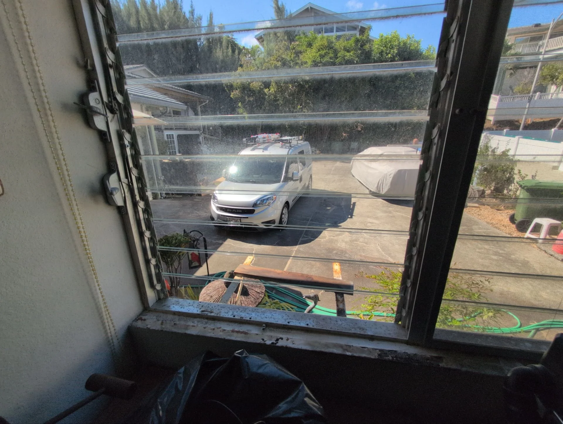 Window a/c removed, wall patched / painted and jalousie glass restored