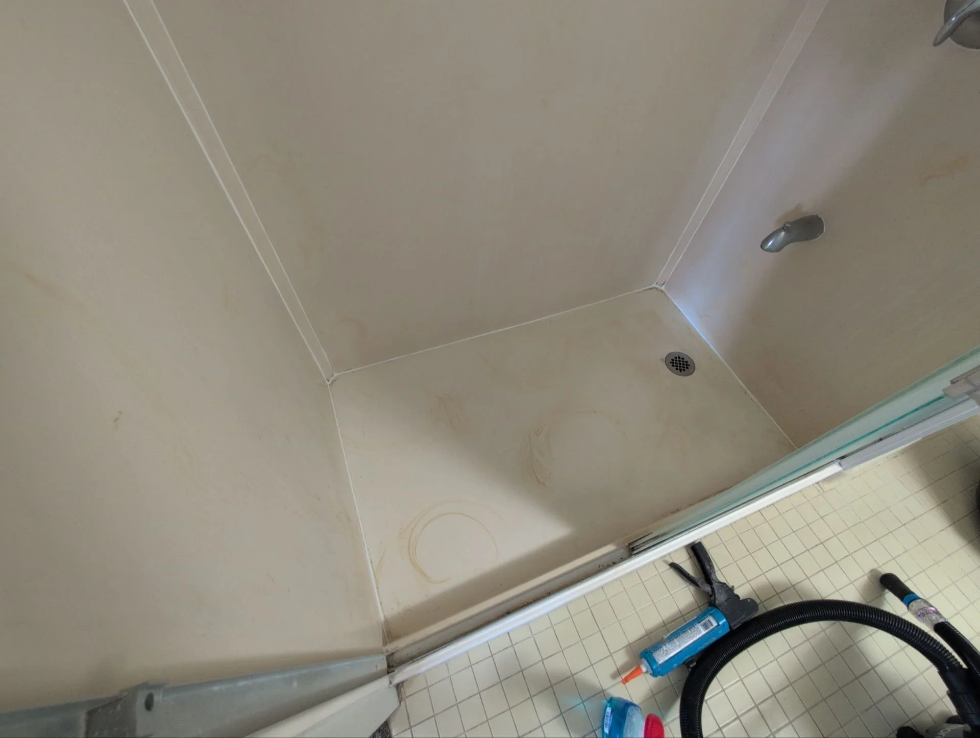 Work at this unit included replacing smoke detectors, repairing a sliding door latch, and a bathtub/shower re-caulk