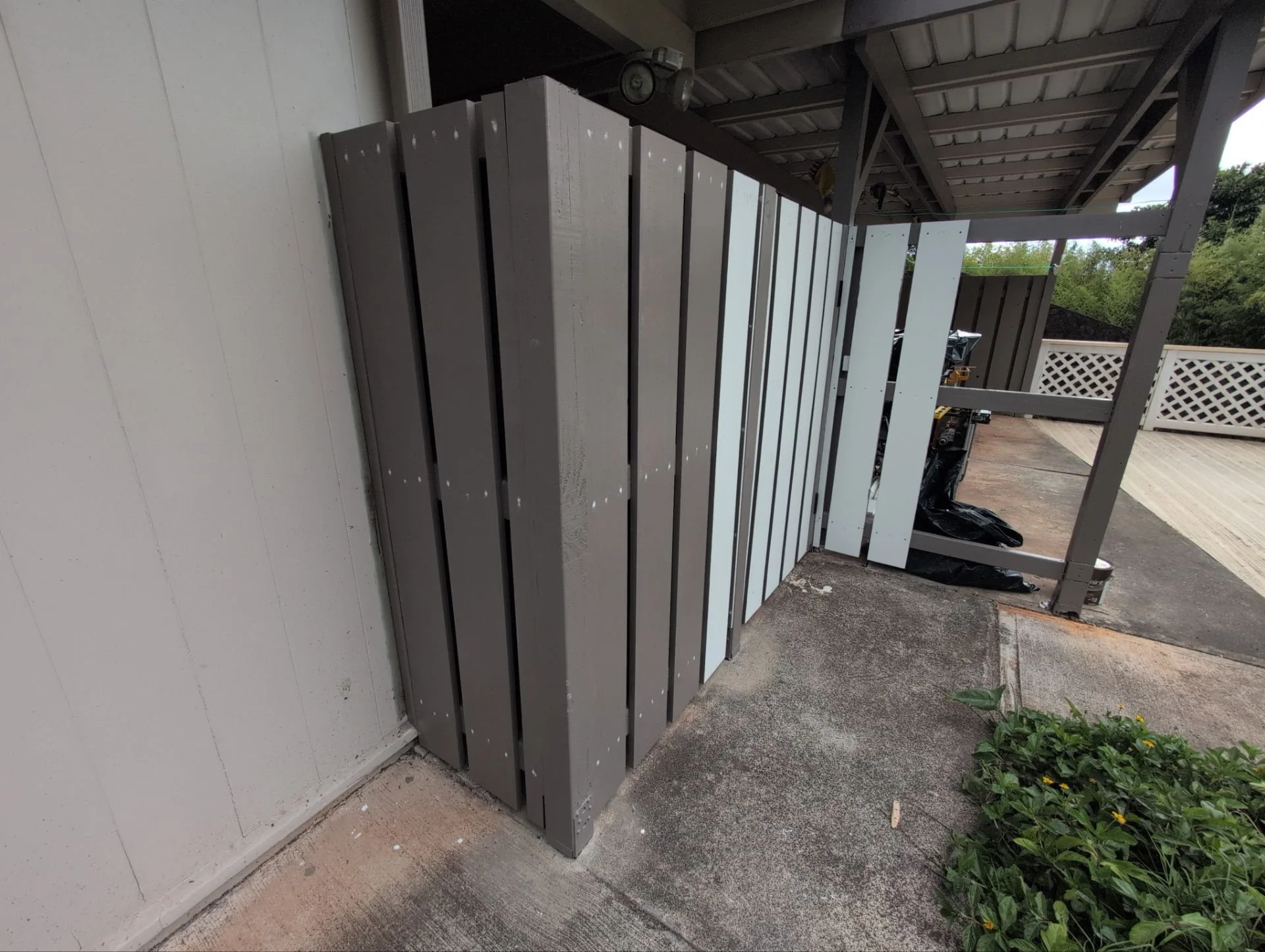 Wooden fence rebuilt using pressure treated lumber, PVC slats / top cap, plus primer & 2 coats of paint